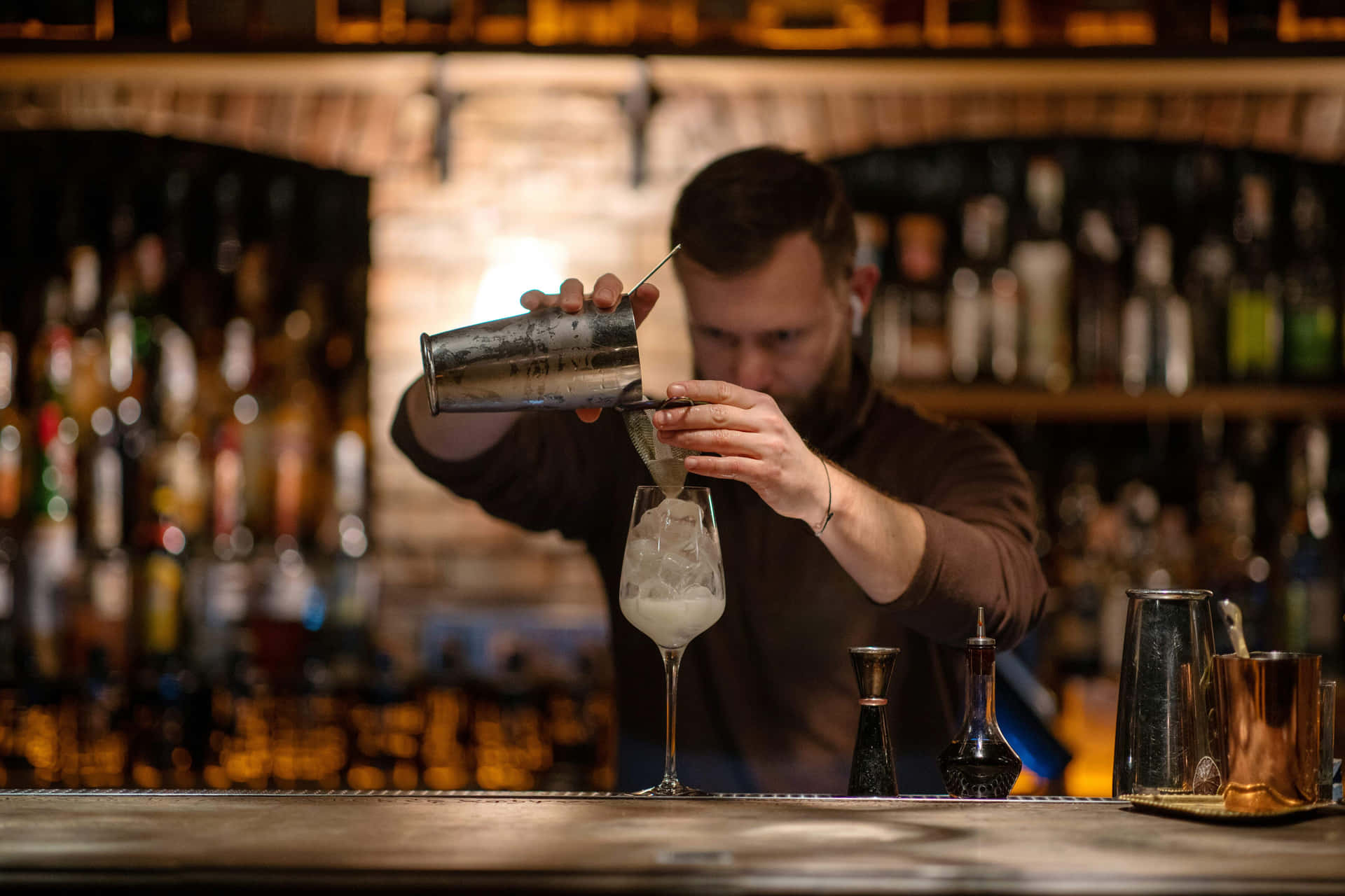 Bartender Pouring Cocktailat Bar.jpg Background