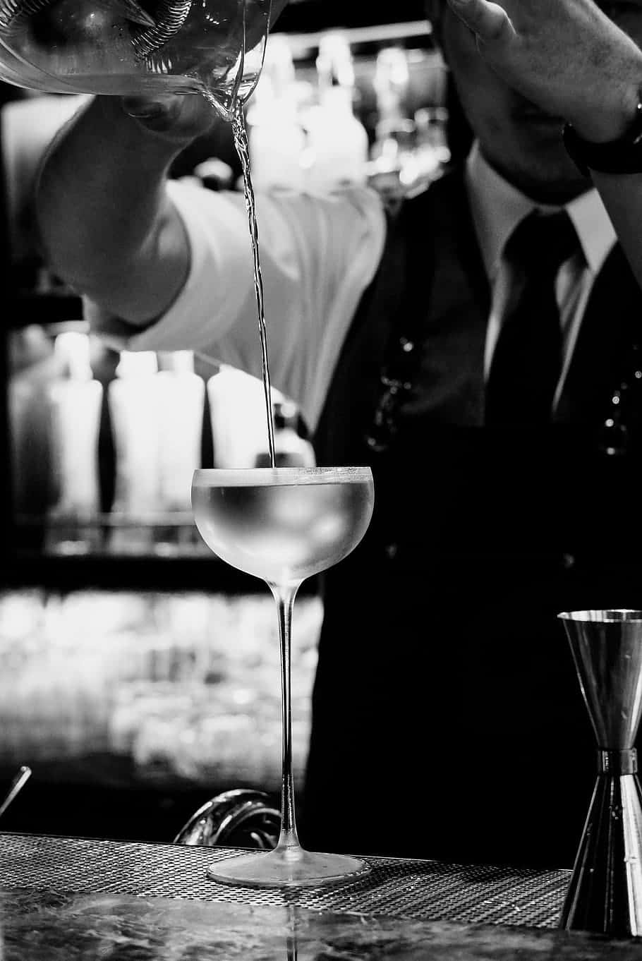 Bartender Pouring Cocktailin Monochrome Background