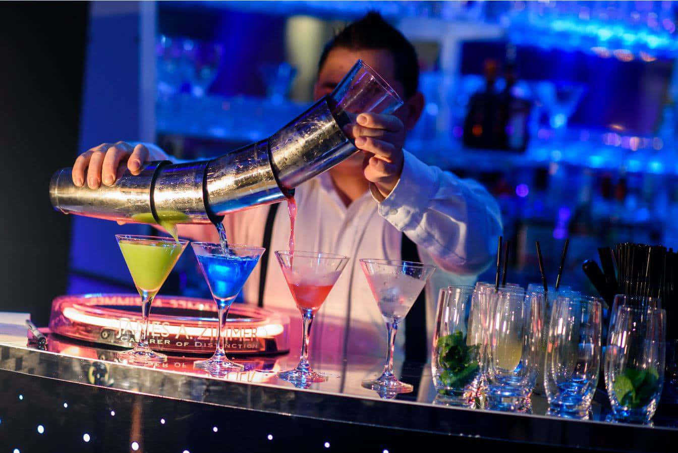 Bartender Pouring Cocktailsat Bar Background