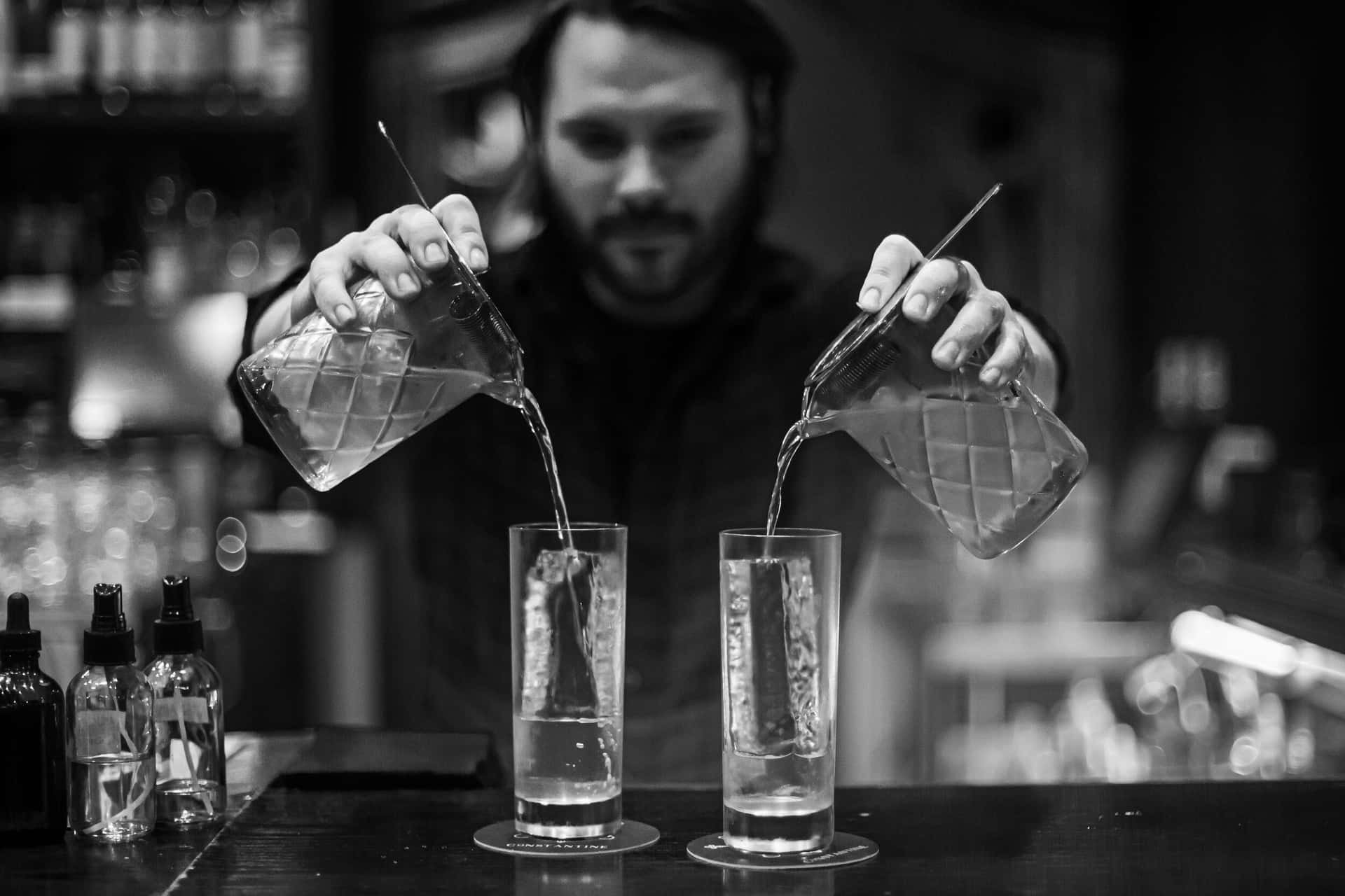 Bartender Pouring Drinks Blackand White Background