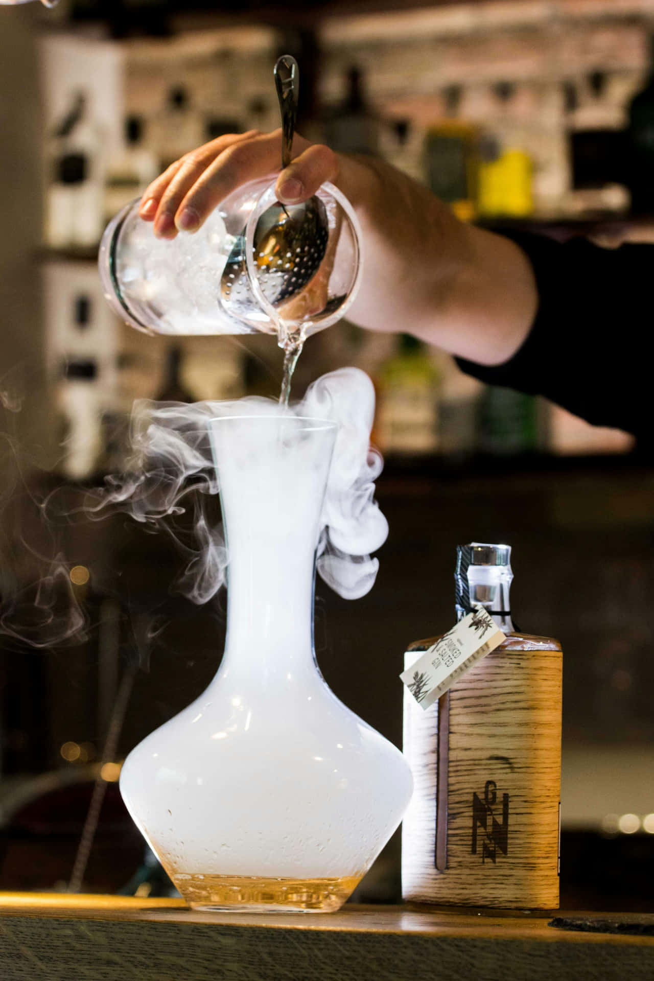 Bartender Pouring Smoky Cocktail Background