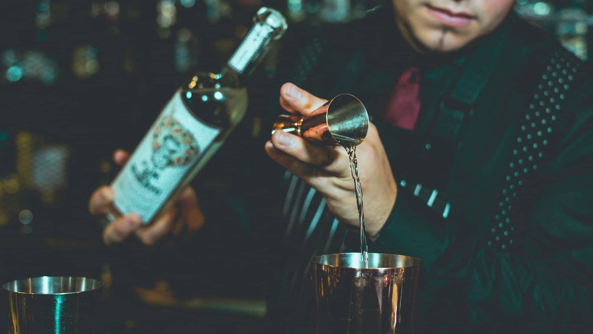 Bartender Pouring Spirit Into Jigger