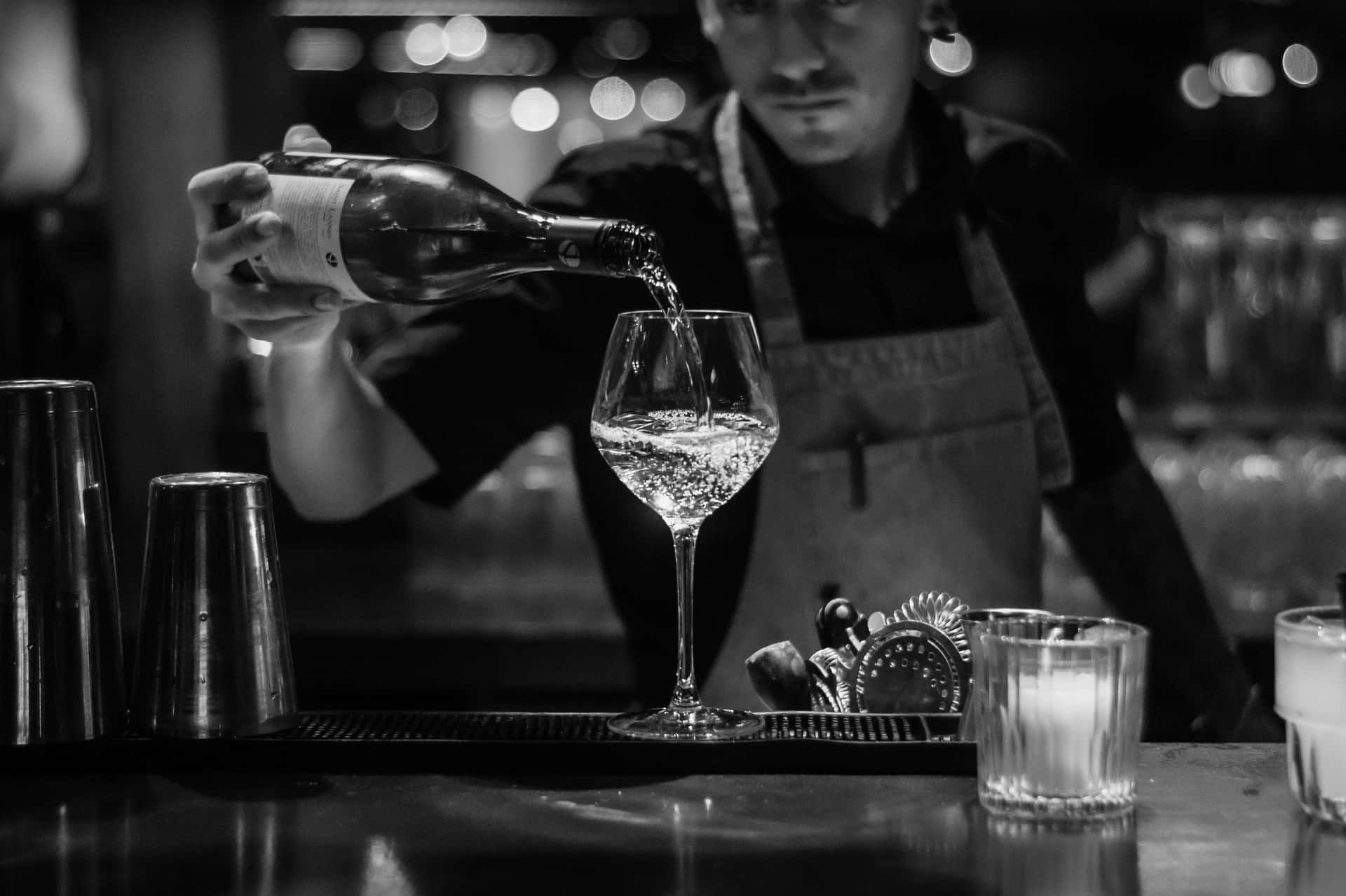 Bartender Pouring Wine Blackand White