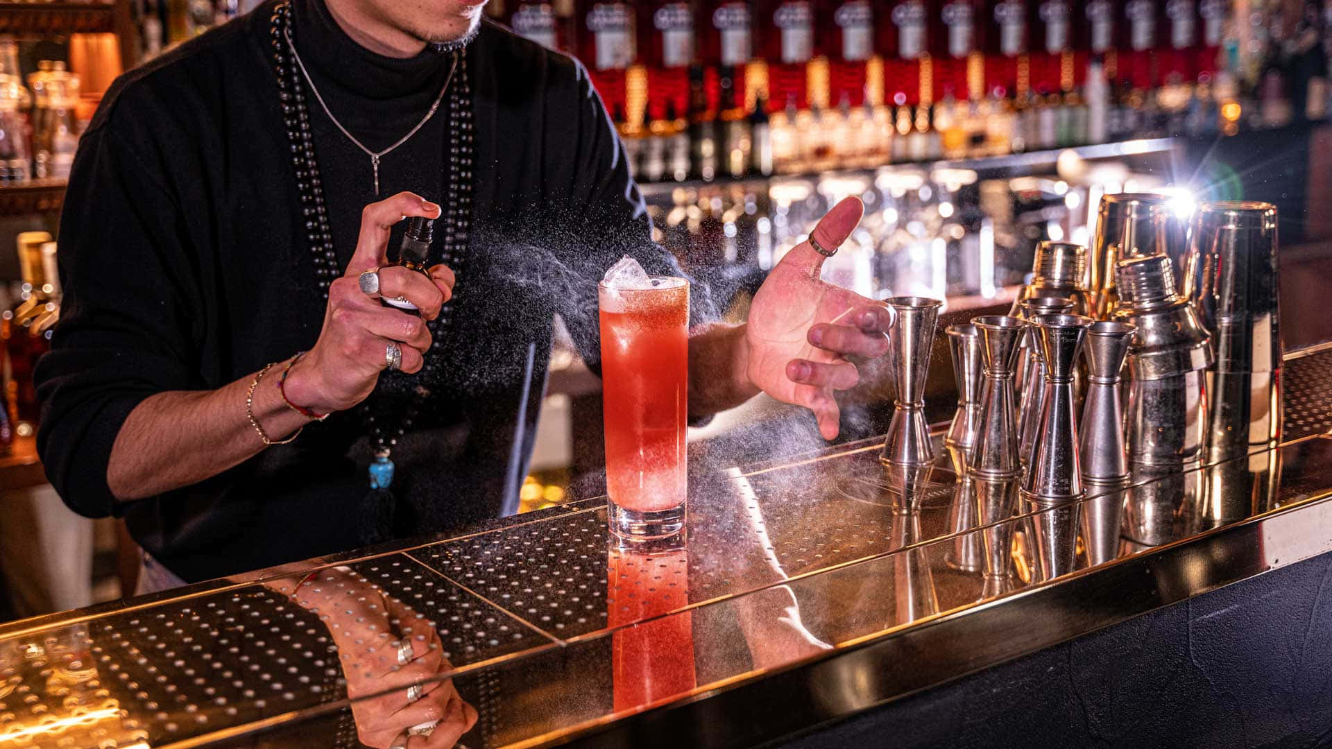 Bartender Spraying Cocktail Garnish.jpg Background