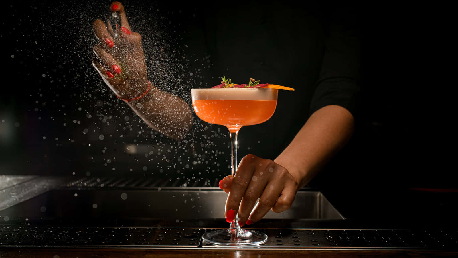 Bartender Sprinkling Garnishon Cocktail.jpg Background