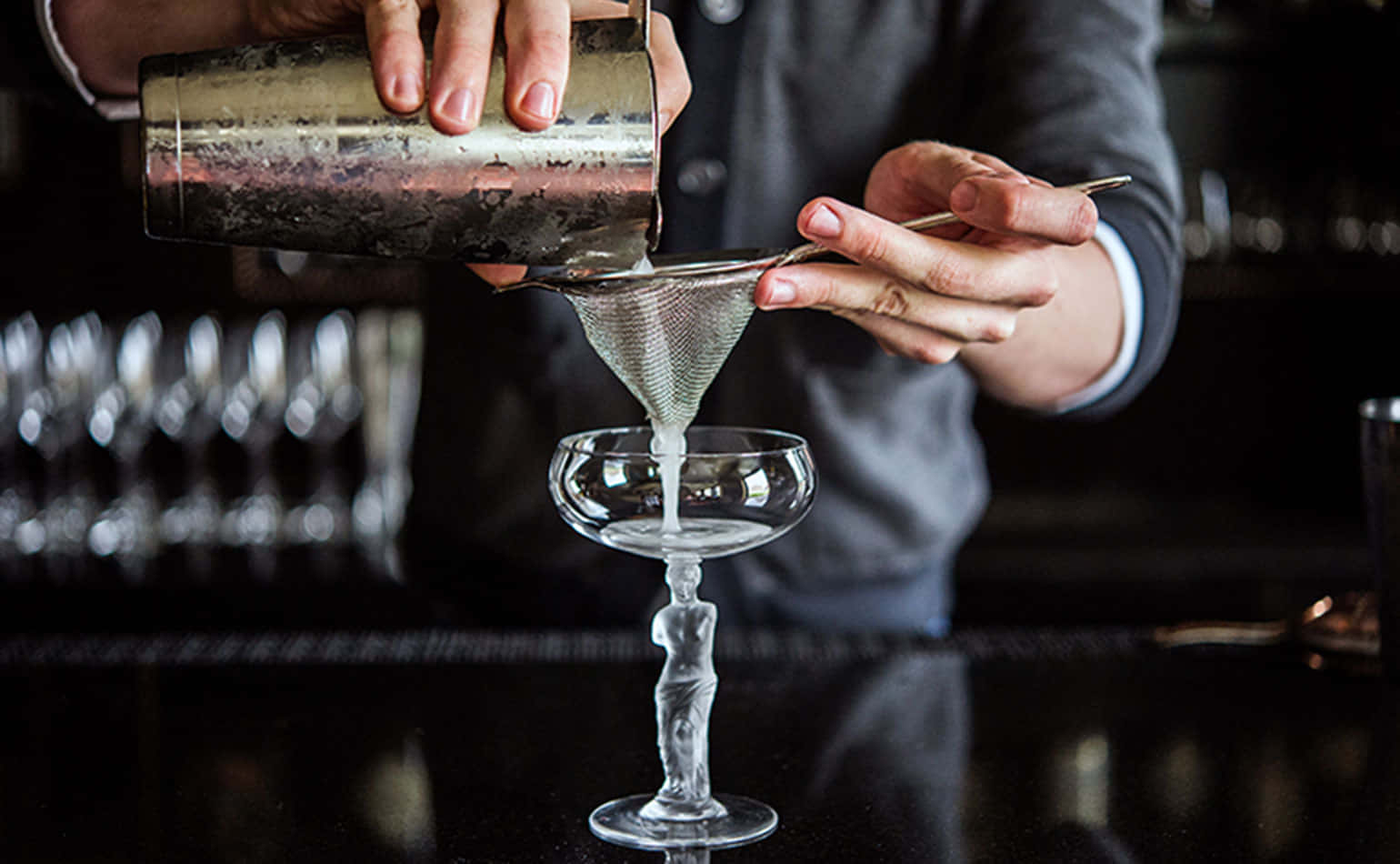 Bartender With Cocktail Strainer Background