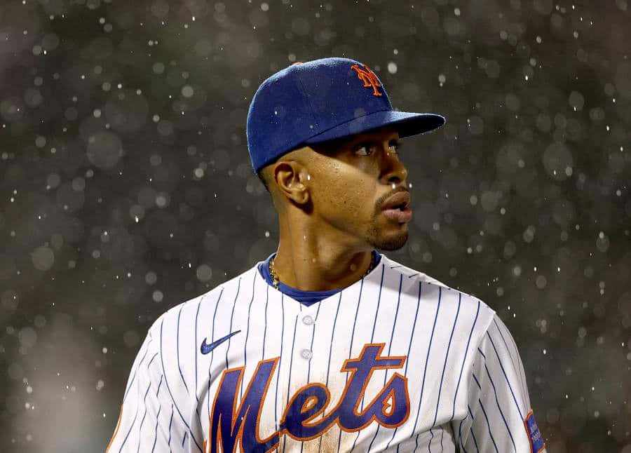 Baseball Playerin Rain During Game Background