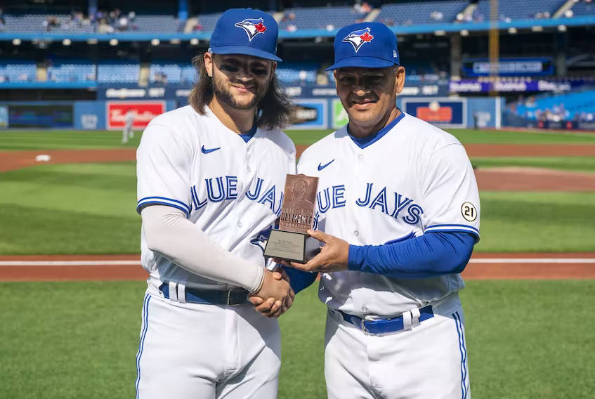 Baseballer Kevin Gausman Receiving A Trophy Background