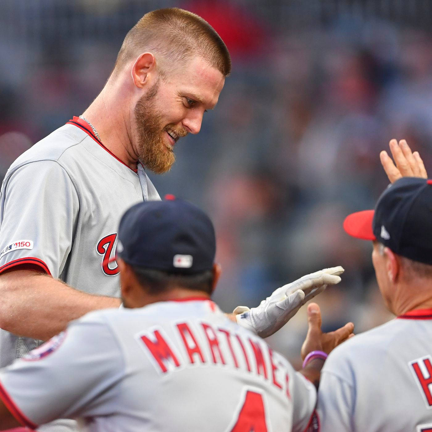 Baseballer Stephen Strasburg Wearing A Gray Jersey Background