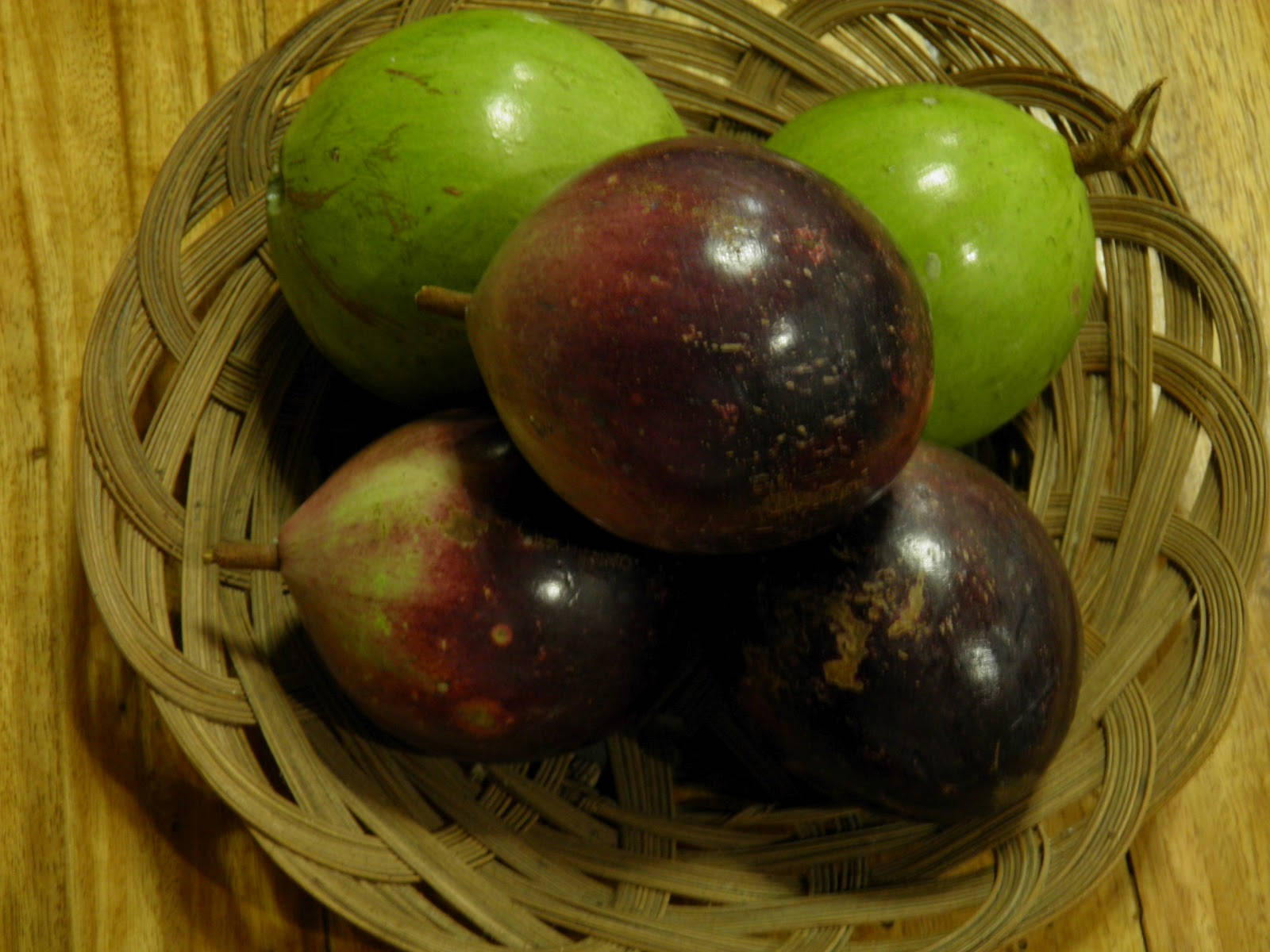 Basket Of Green And Purple Star Apples