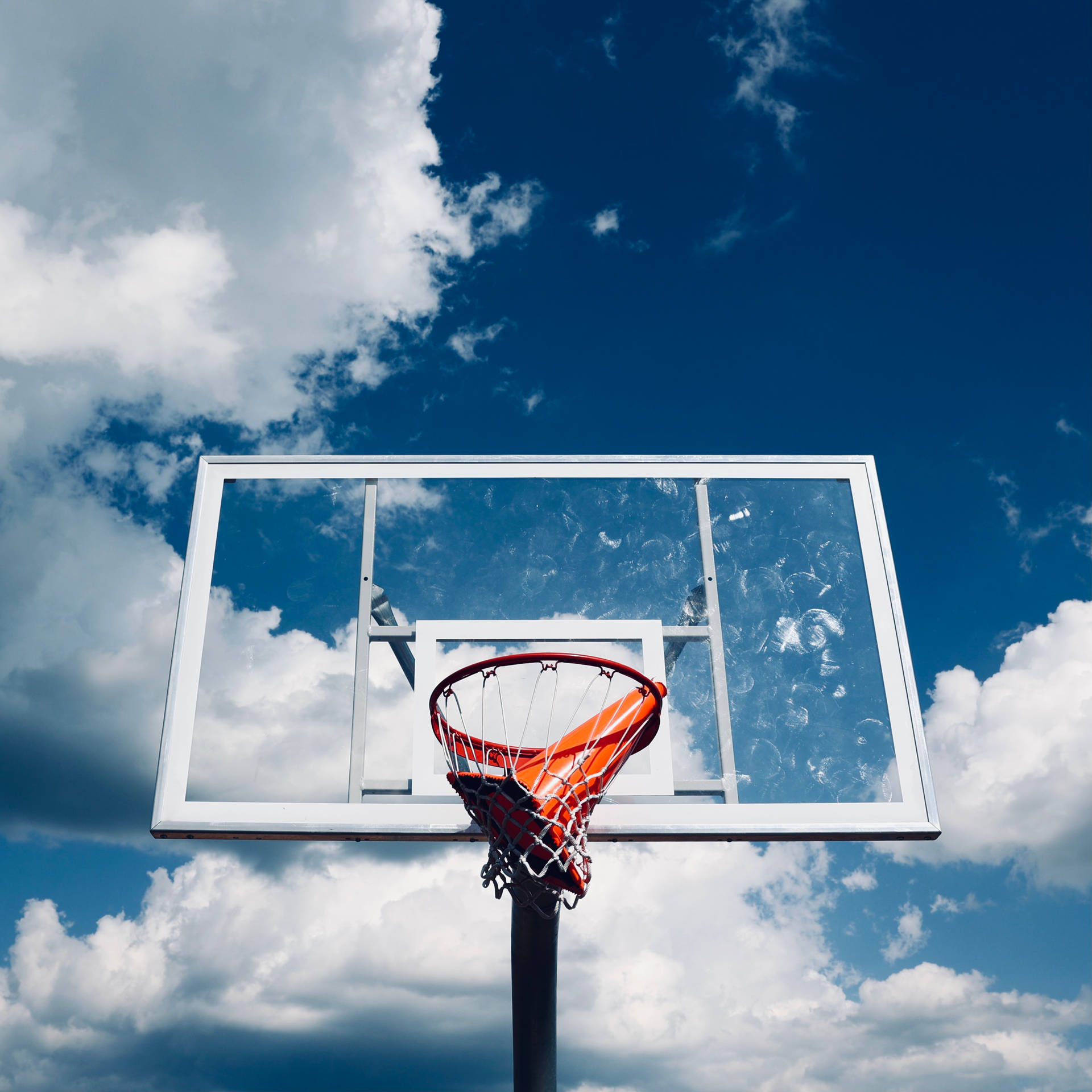 Basketball Hoop Against Azure Sky Background