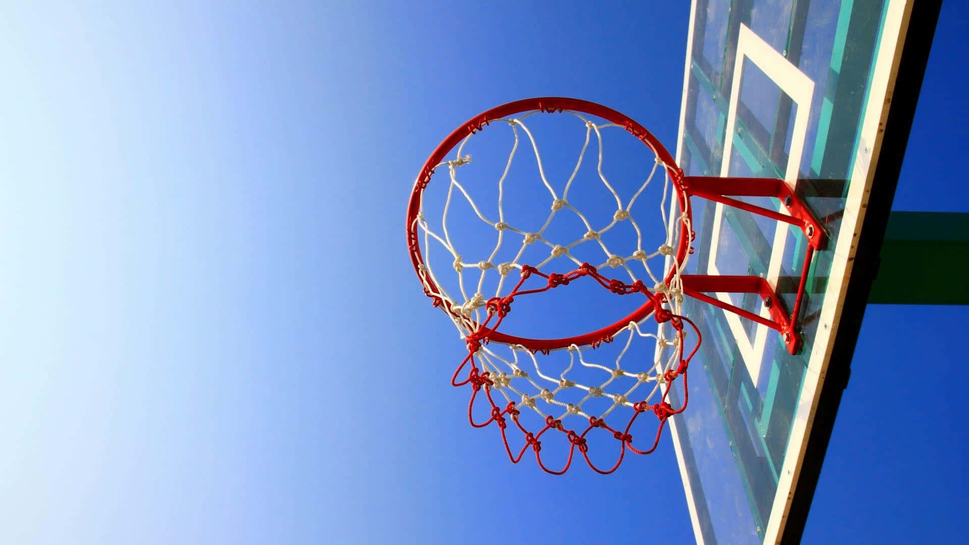 Basketball Hoop Against Blue Sky Background