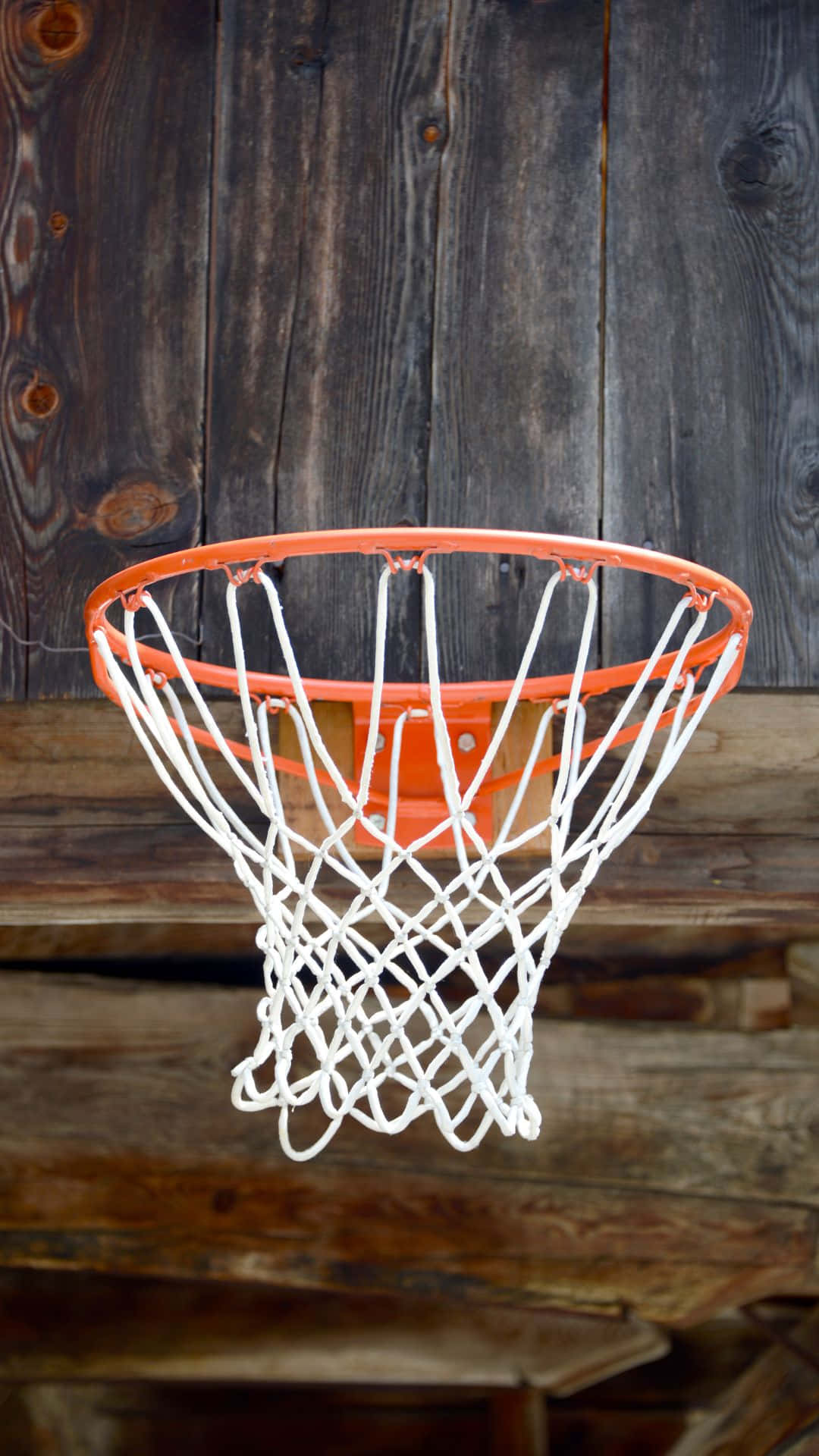 Basketball Hoop Against Wooden Backdrop Background