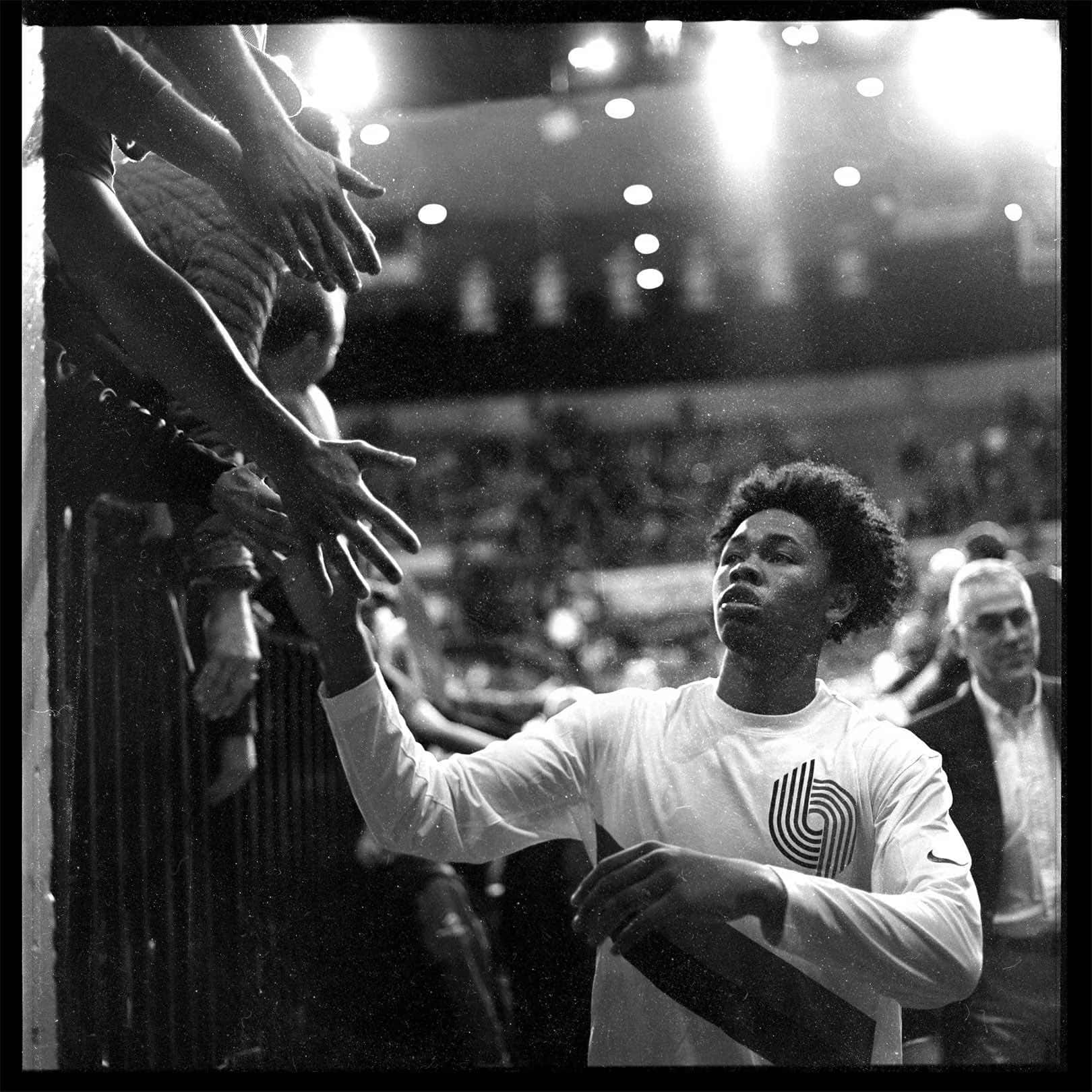 Basketball Player High Fiving Fans Background