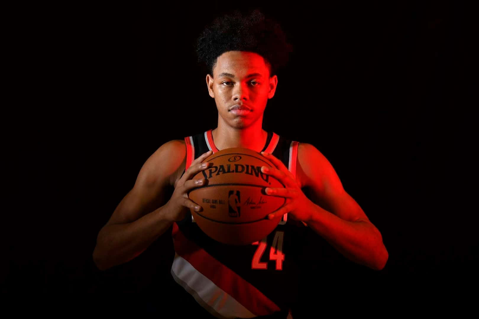 Basketball Player Holding Ball Dark Background Background