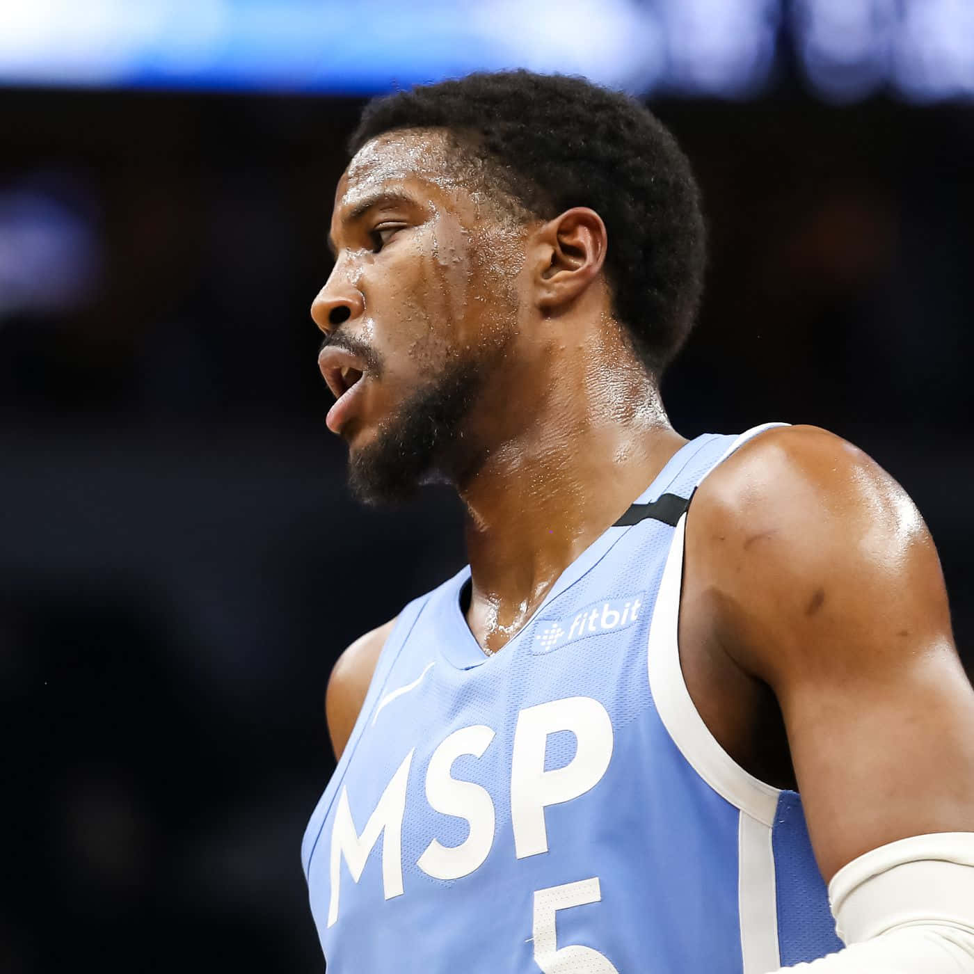 Basketball Player Malik Beasley Against Denver Nuggets Background