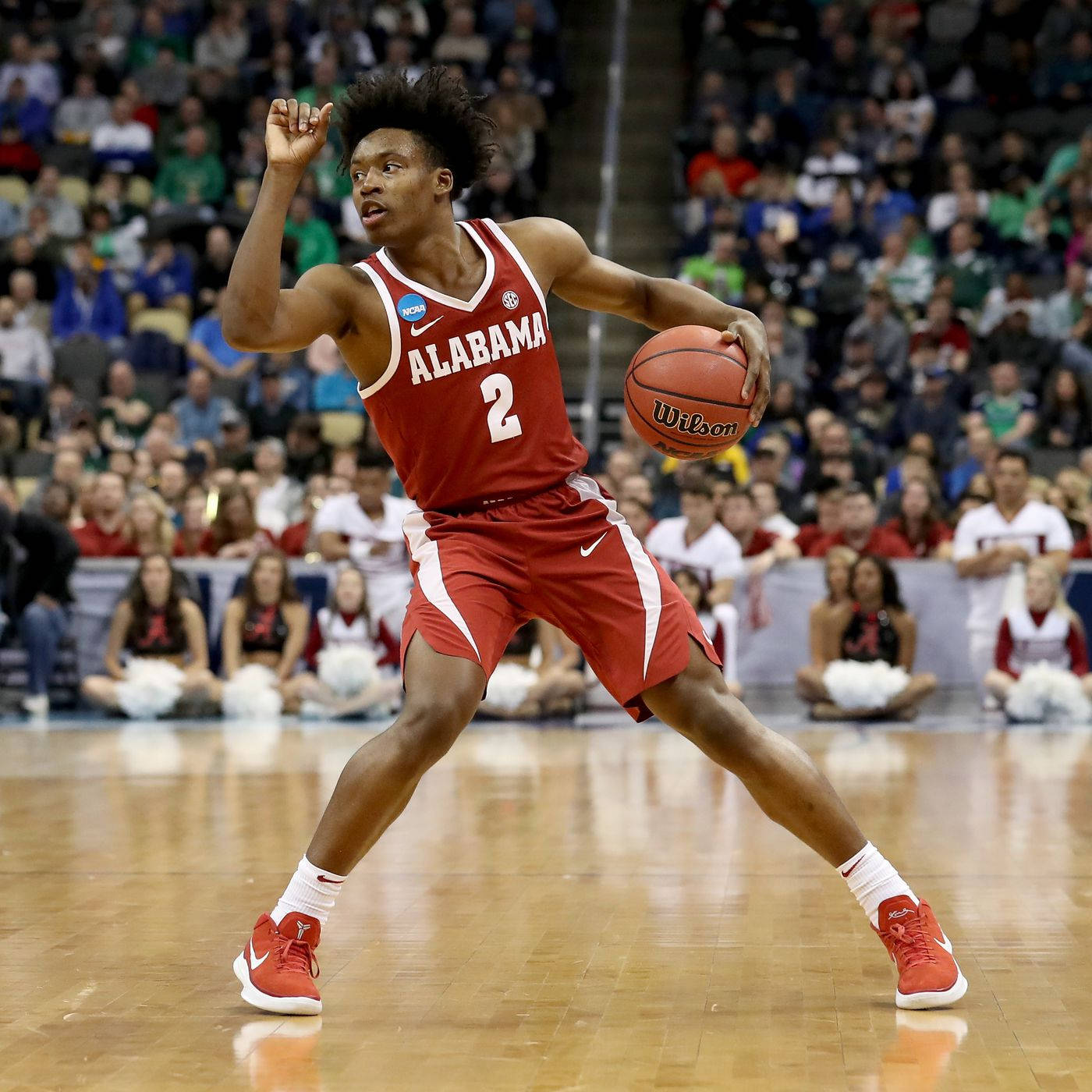 Basketball Star Collin Sexton In Red Team Jersey Background