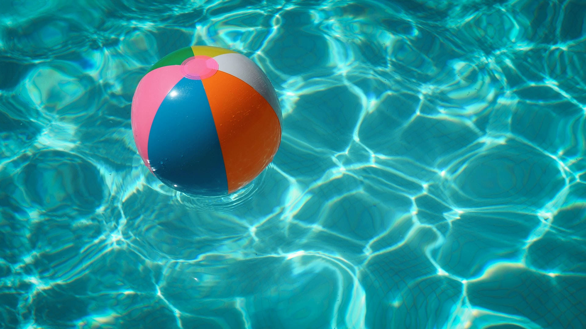 Beach Ball And Moving Water Background