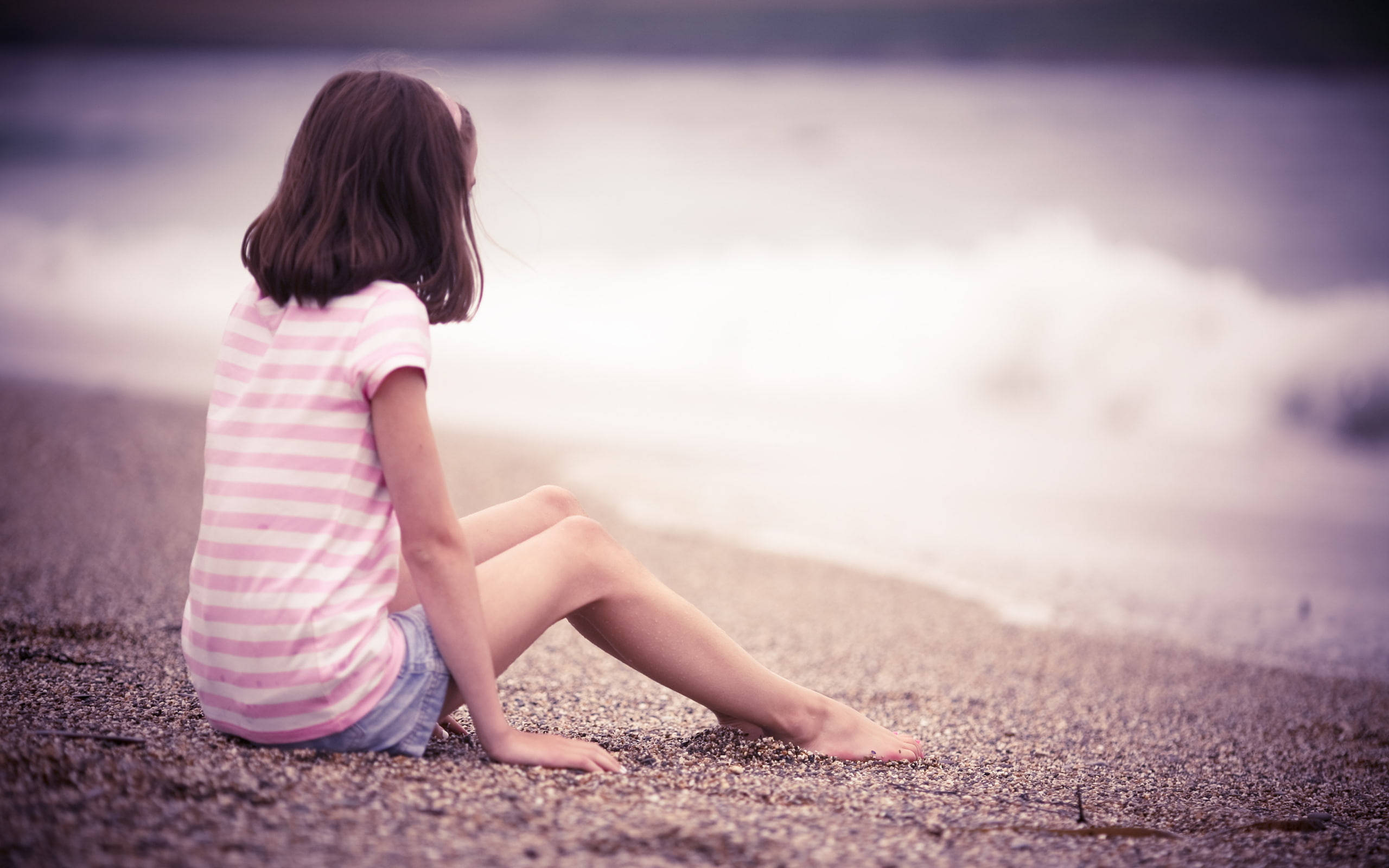 Beach Girl Sitting Near Water Background