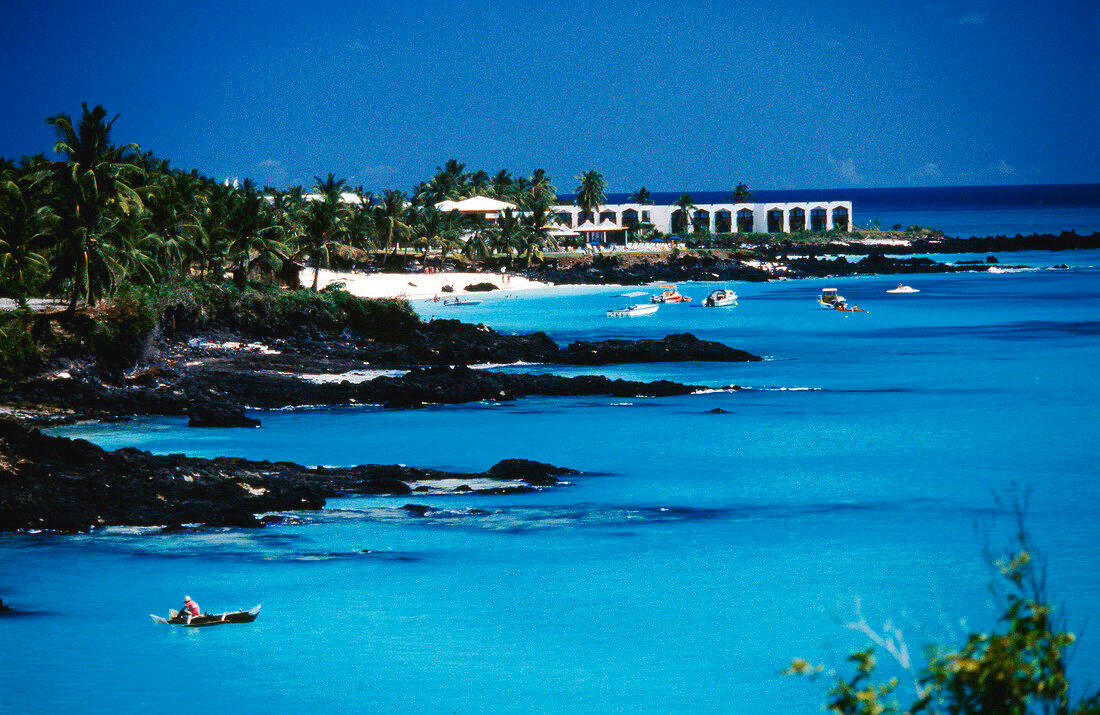 Beach In Comoros Surrounded By Rocks Background