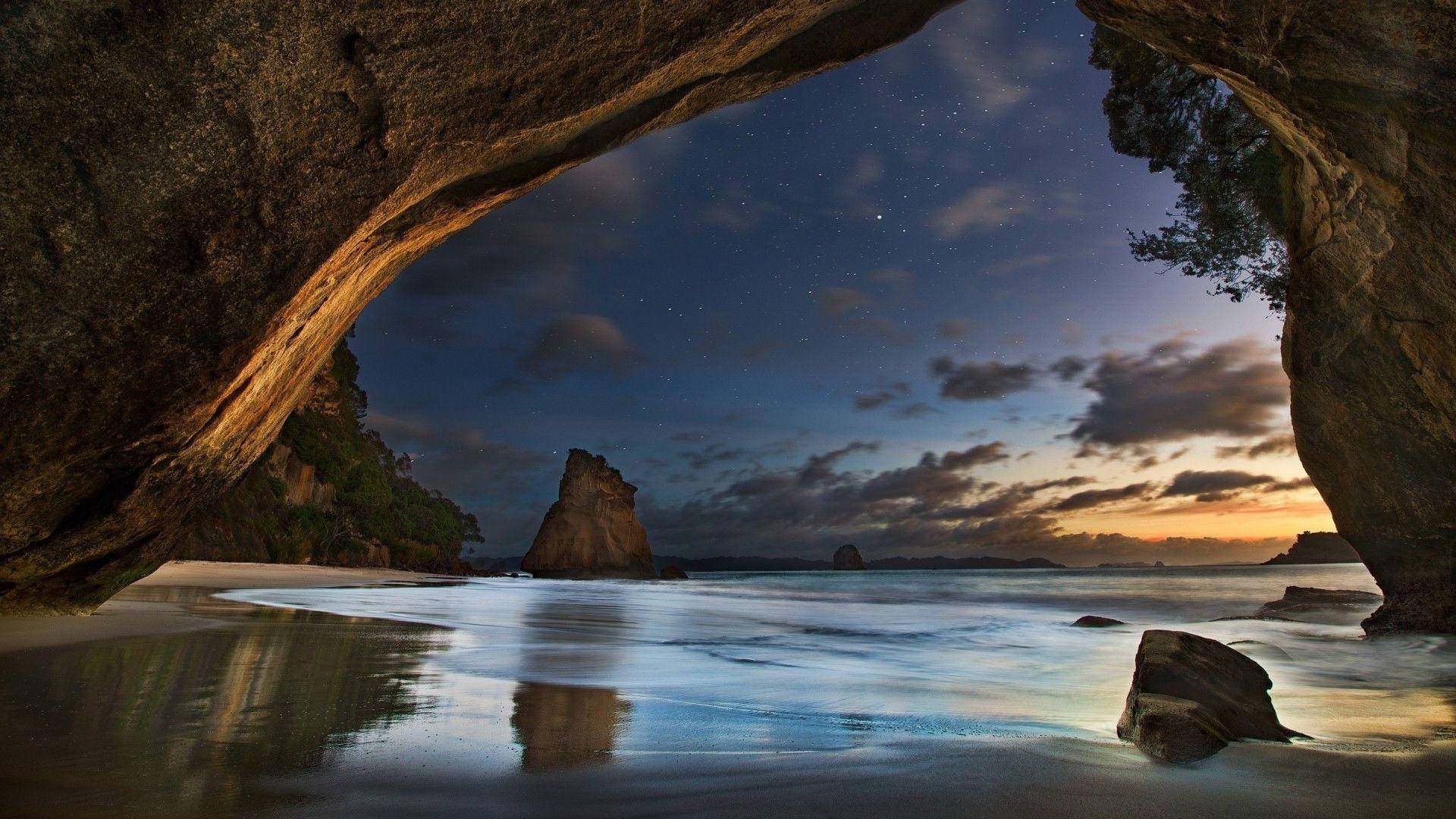 Beach Night Under The Cave Background