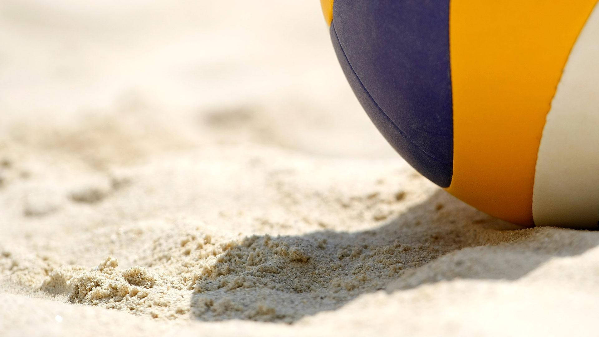 Beach Volleyball On The Sand Background