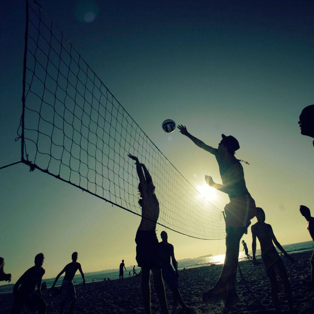 Beach Volleyball Silhouette On A Sunny Day