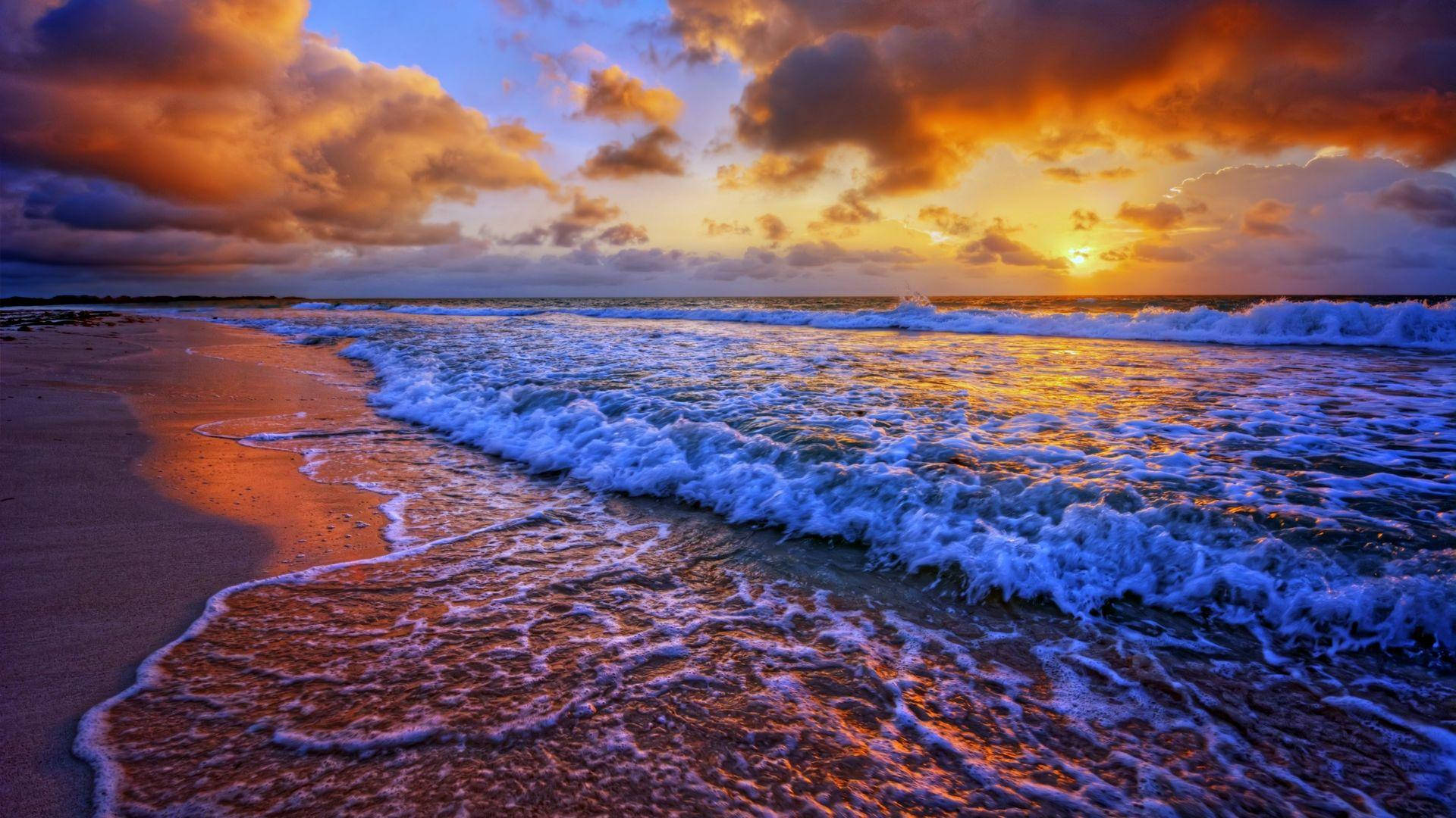 Beachside Waves On Dark Sunset Background