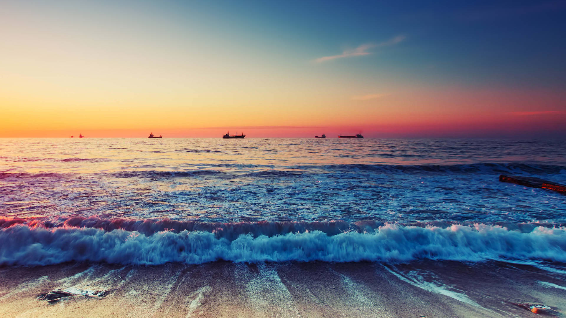 Beautiful Beach With Ships In The Distance