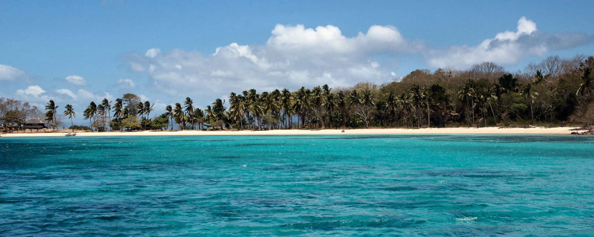 “beautiful Beaches Are Perfectly Framed By A Dual Monitor” Background