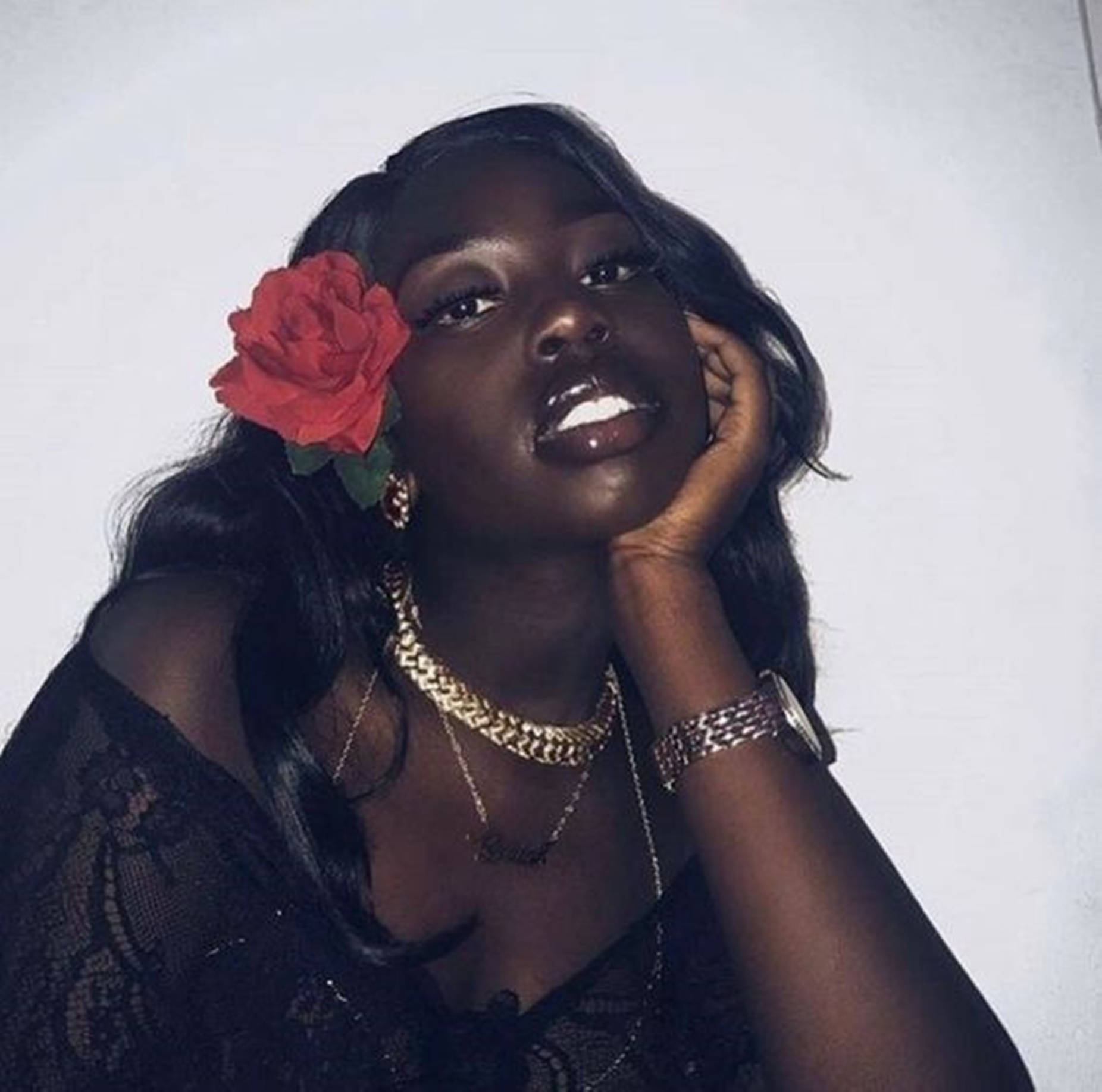 Beautiful Black Woman With A Rose In Her Hair