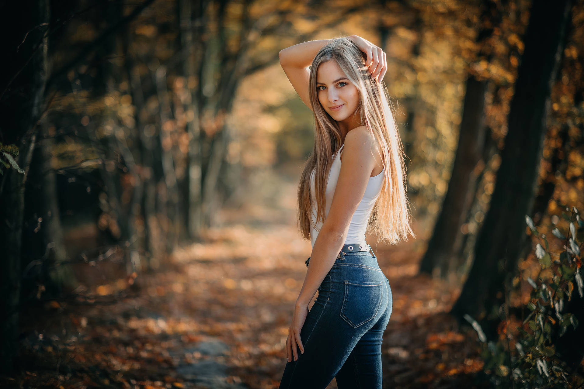 Beautiful Blondes Posing In A Forest Background