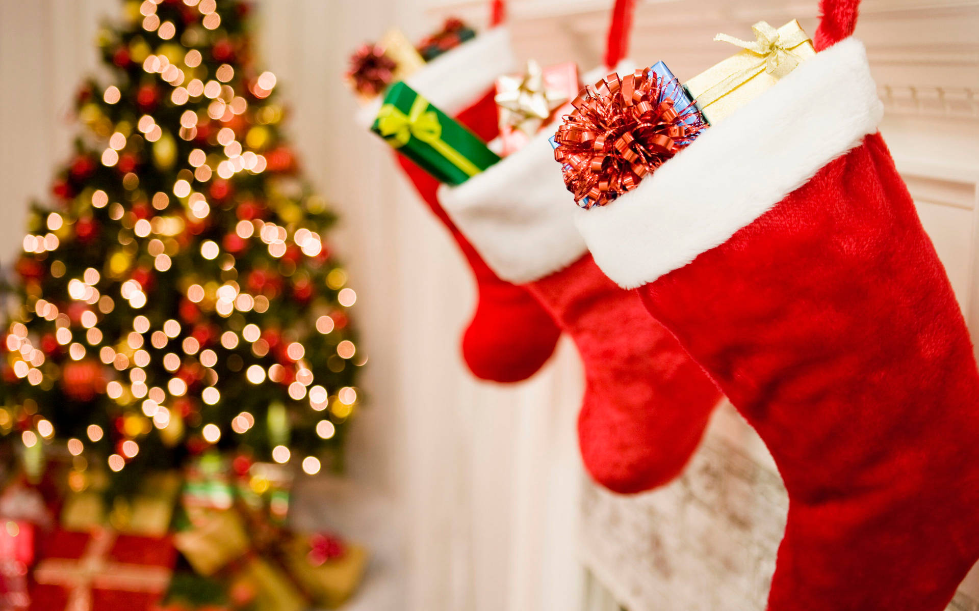 Beautiful Christmas Stockings With Gifts Background