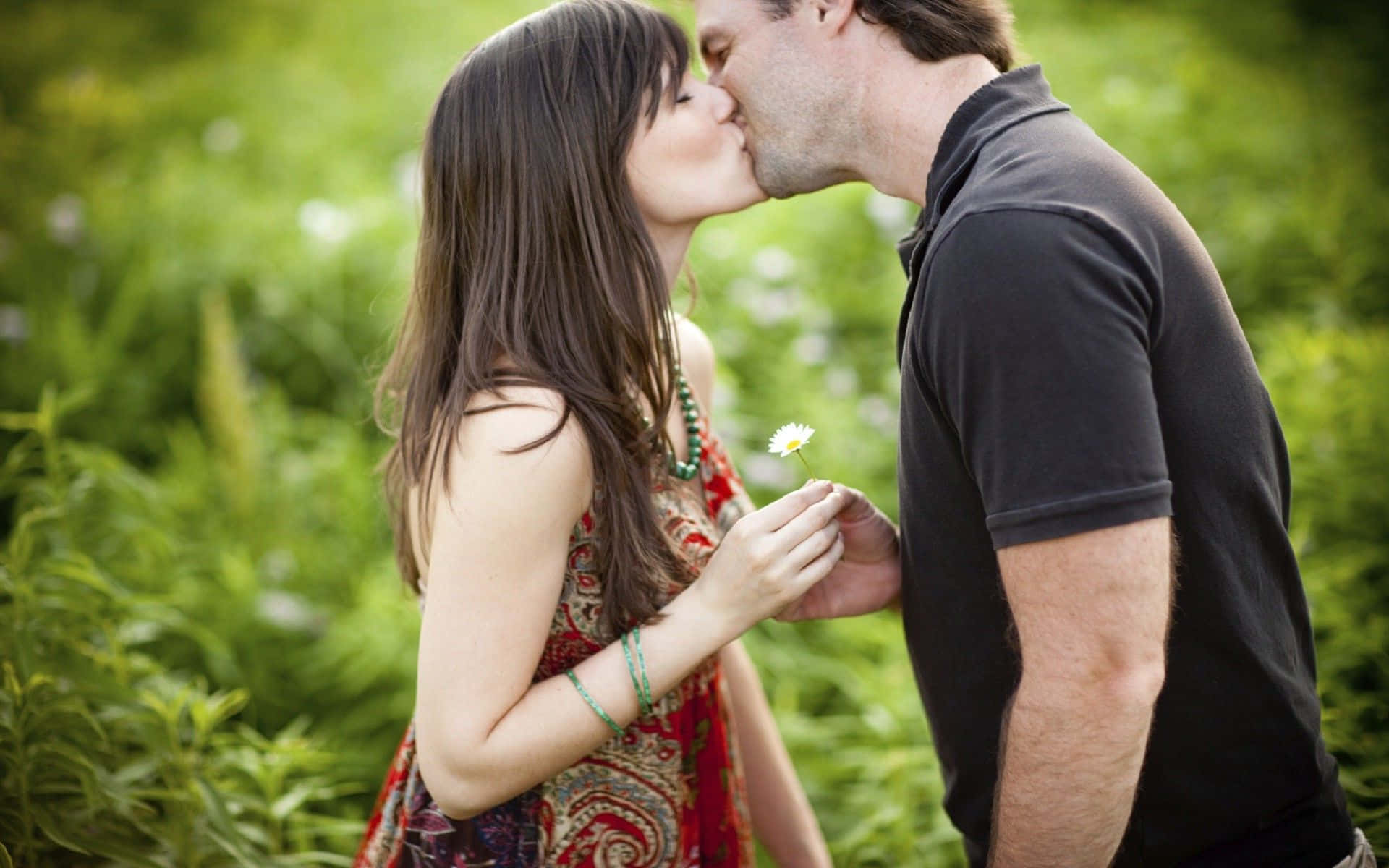 Beautiful Couple Kissing Their Lips