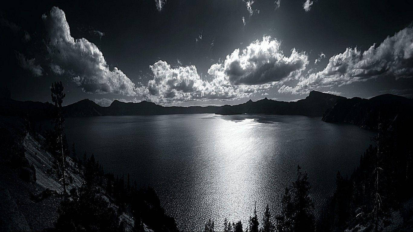 Beautiful Dark Grayscale Lake With Mountains Background