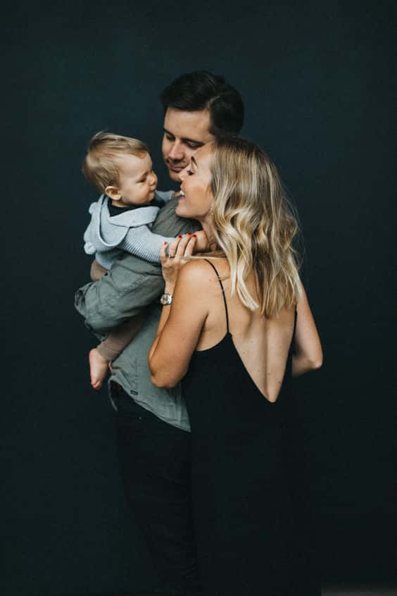 Beautiful Family Portrait Of Three Background