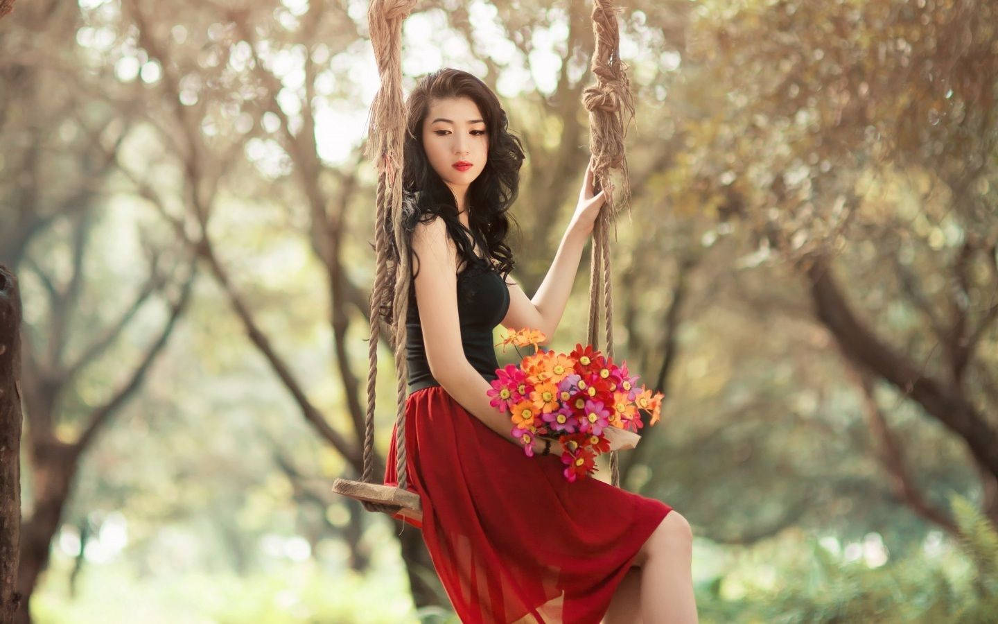 Beautiful Girl Posing On A Swing