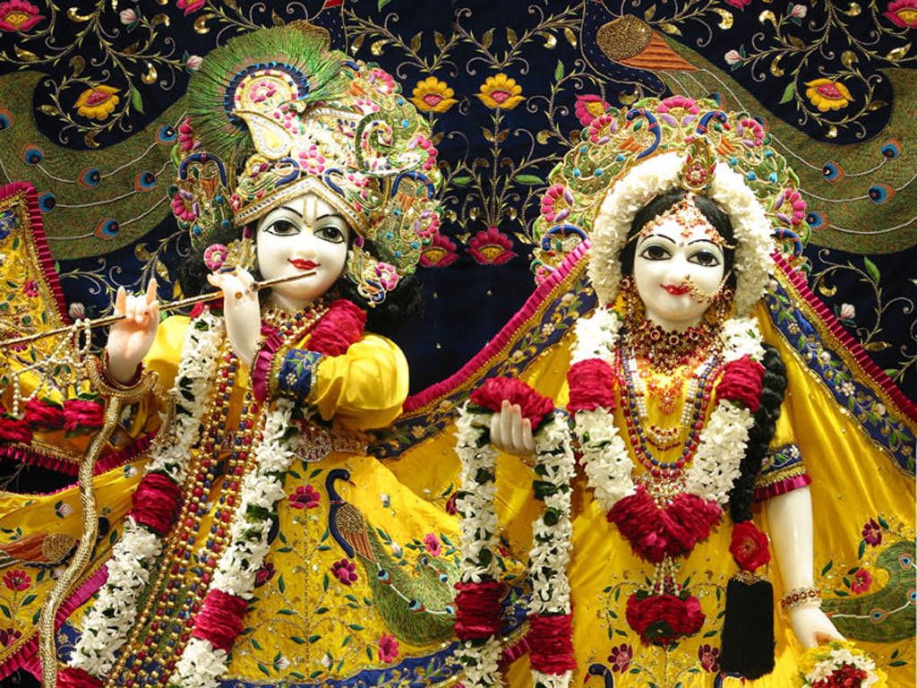 Beautiful Krishna And Radha God Figurines Background