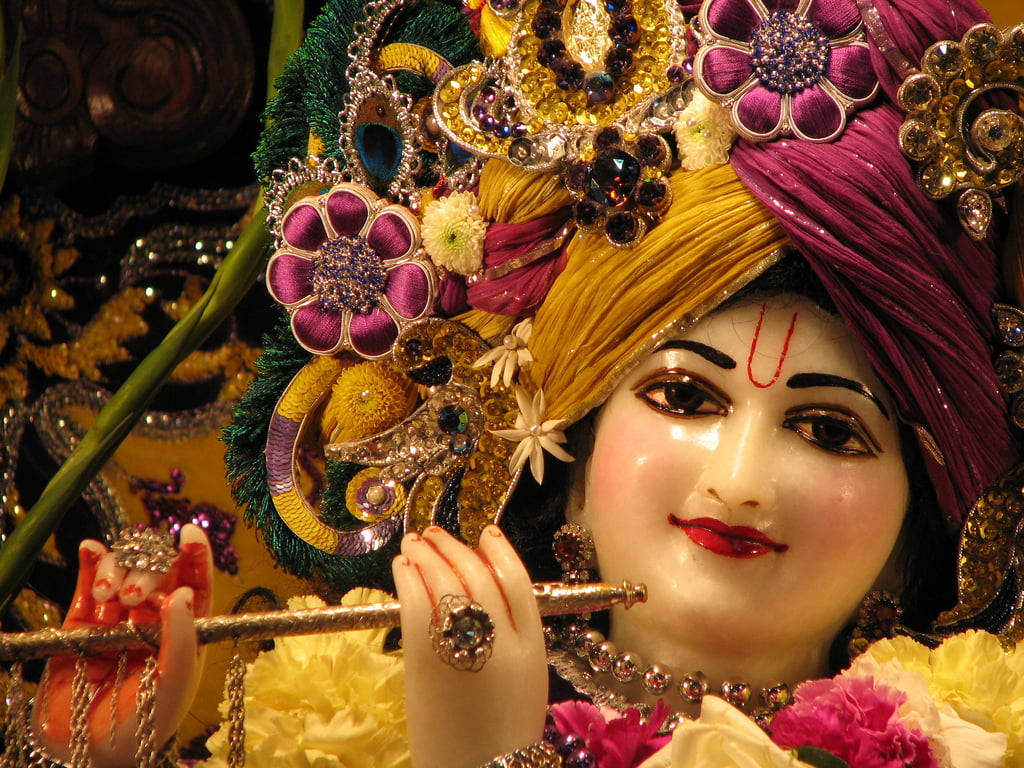 Beautiful Krishna Statue Smile Background