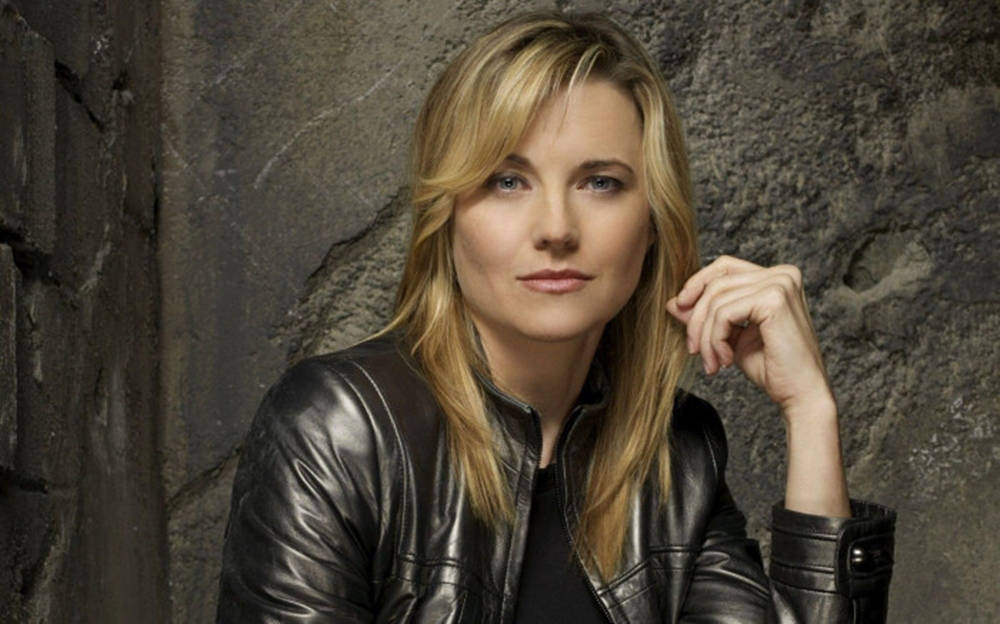 Beautiful Lucy Lawless In Leather Jacket Background