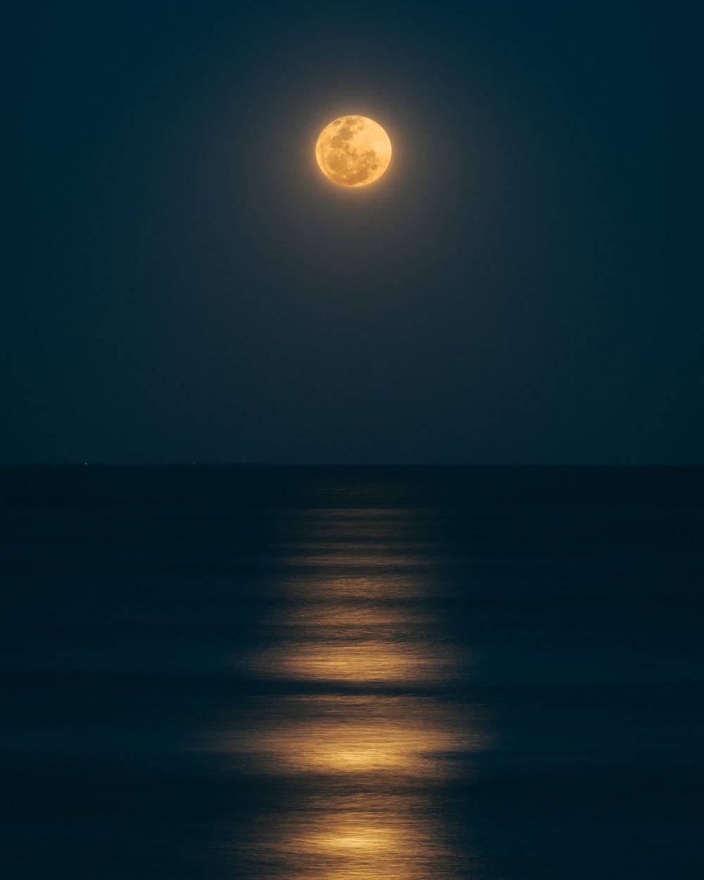 Beautiful Moon Above The Calm Sea Background