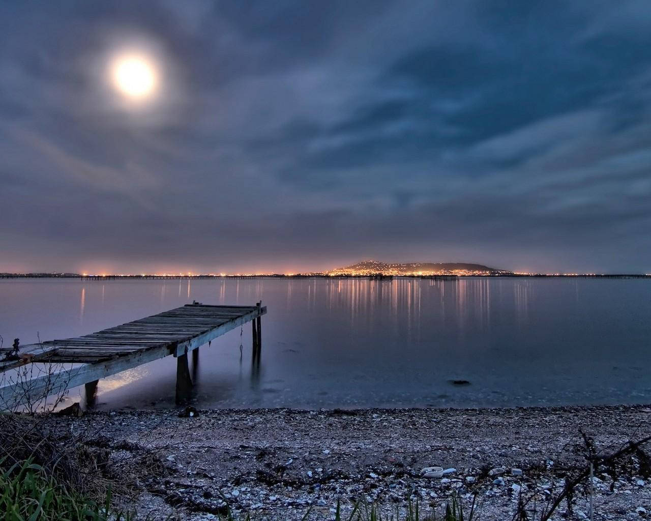 Beautiful Moon Glowing At Night Background