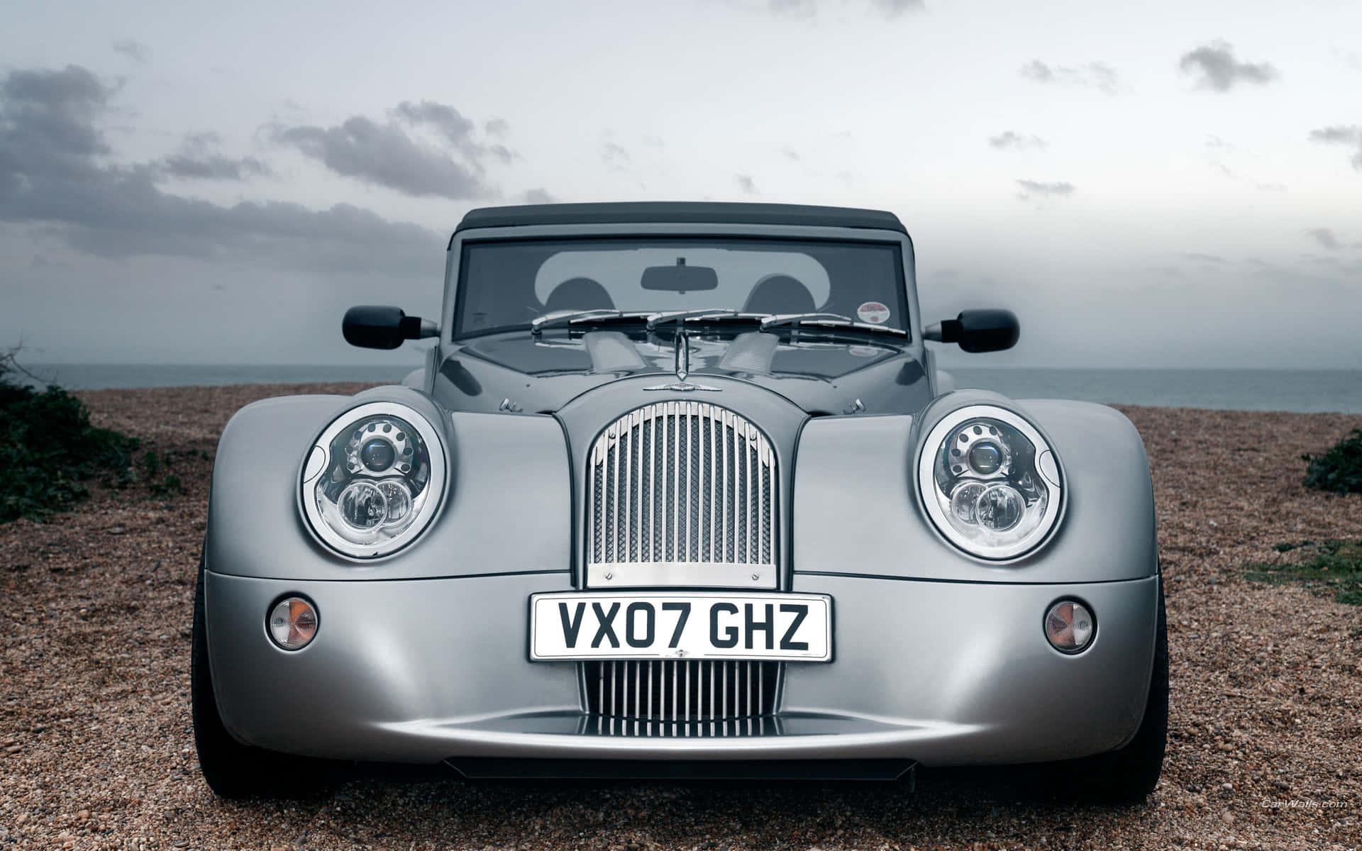 Beautiful Morgan Sports Car Parked By The Picturesque Coast Background