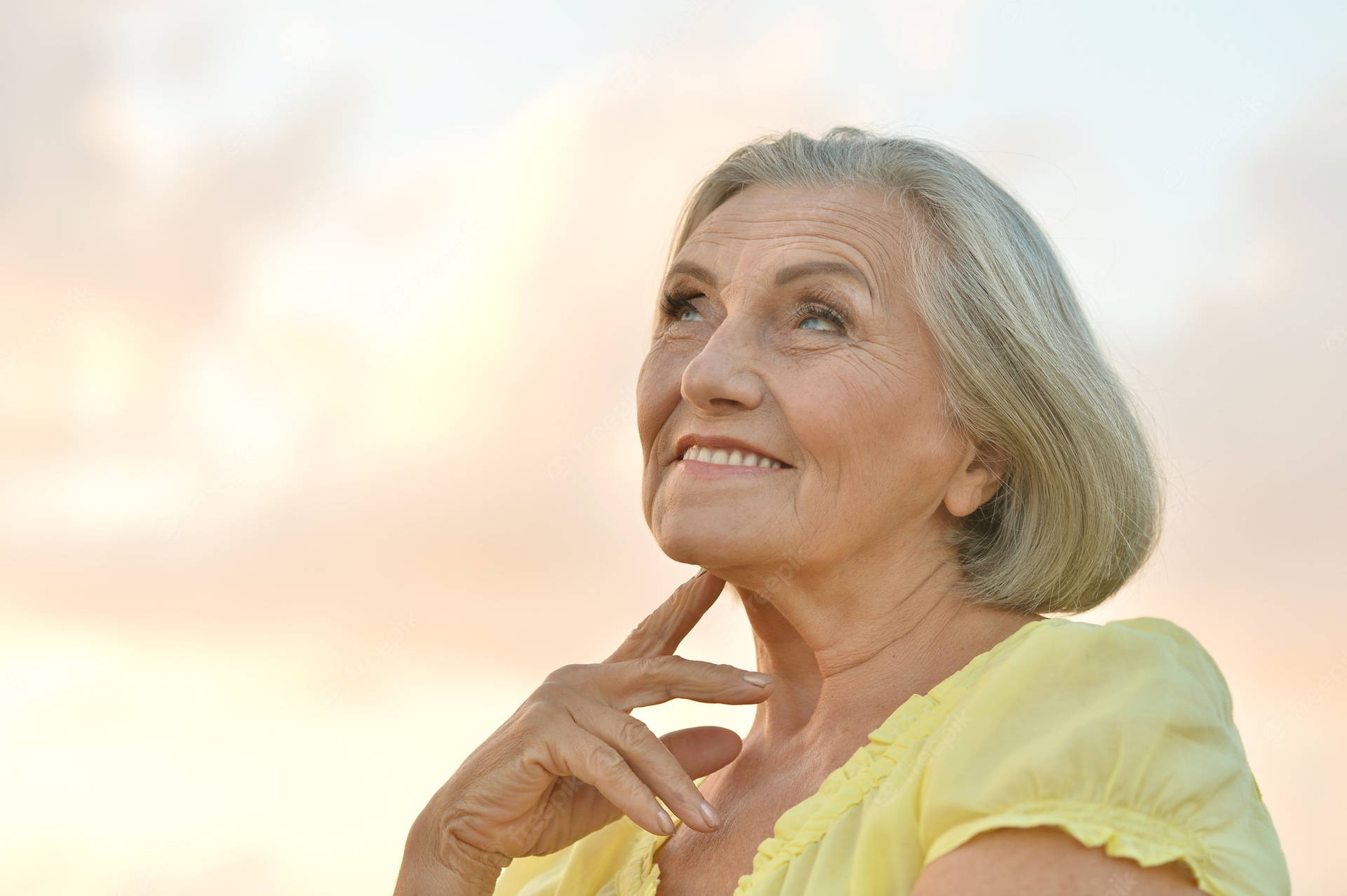 Beautiful Older Woman Yellow Top Background