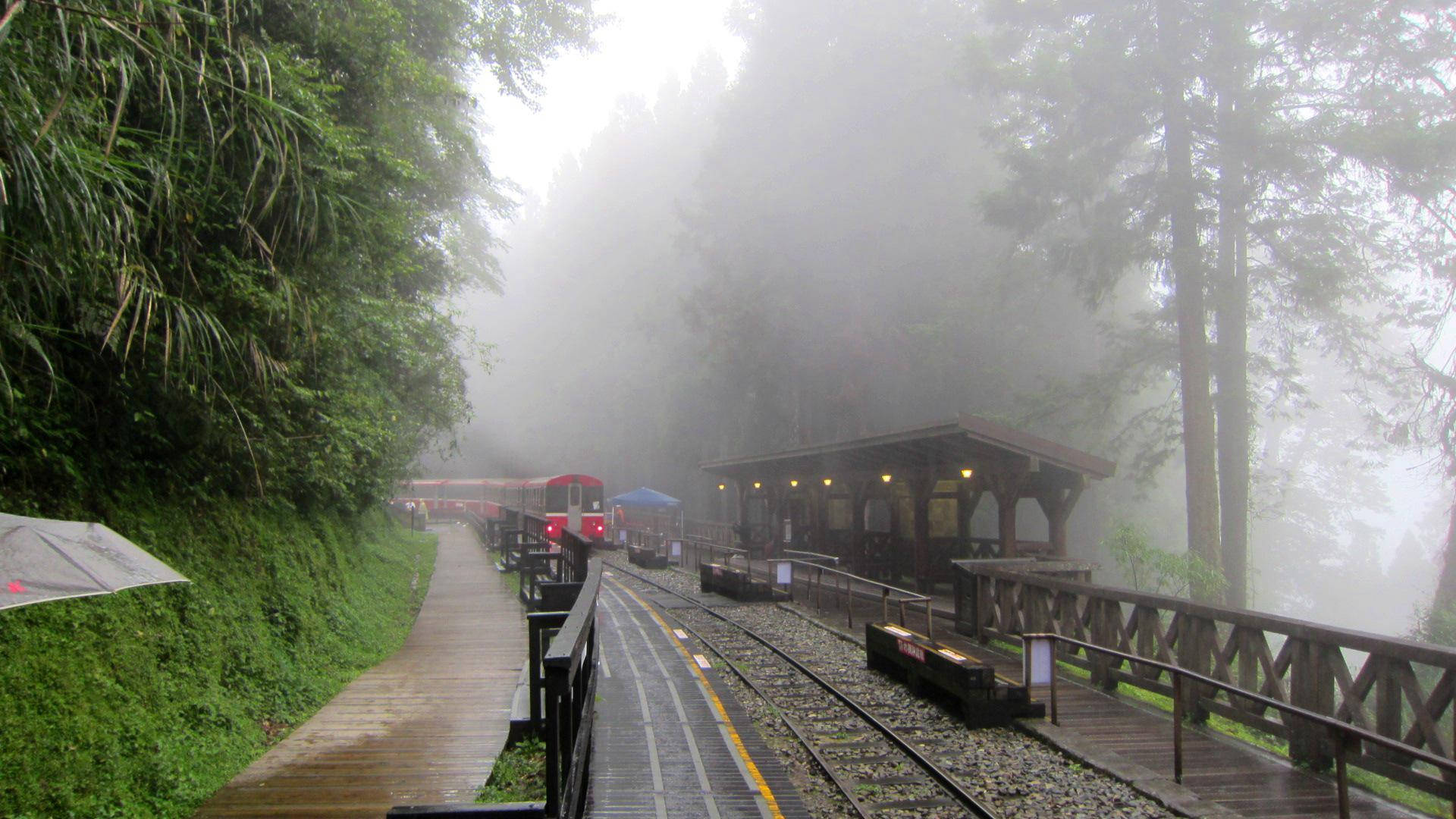 Beautiful Rain At The Train Station Background