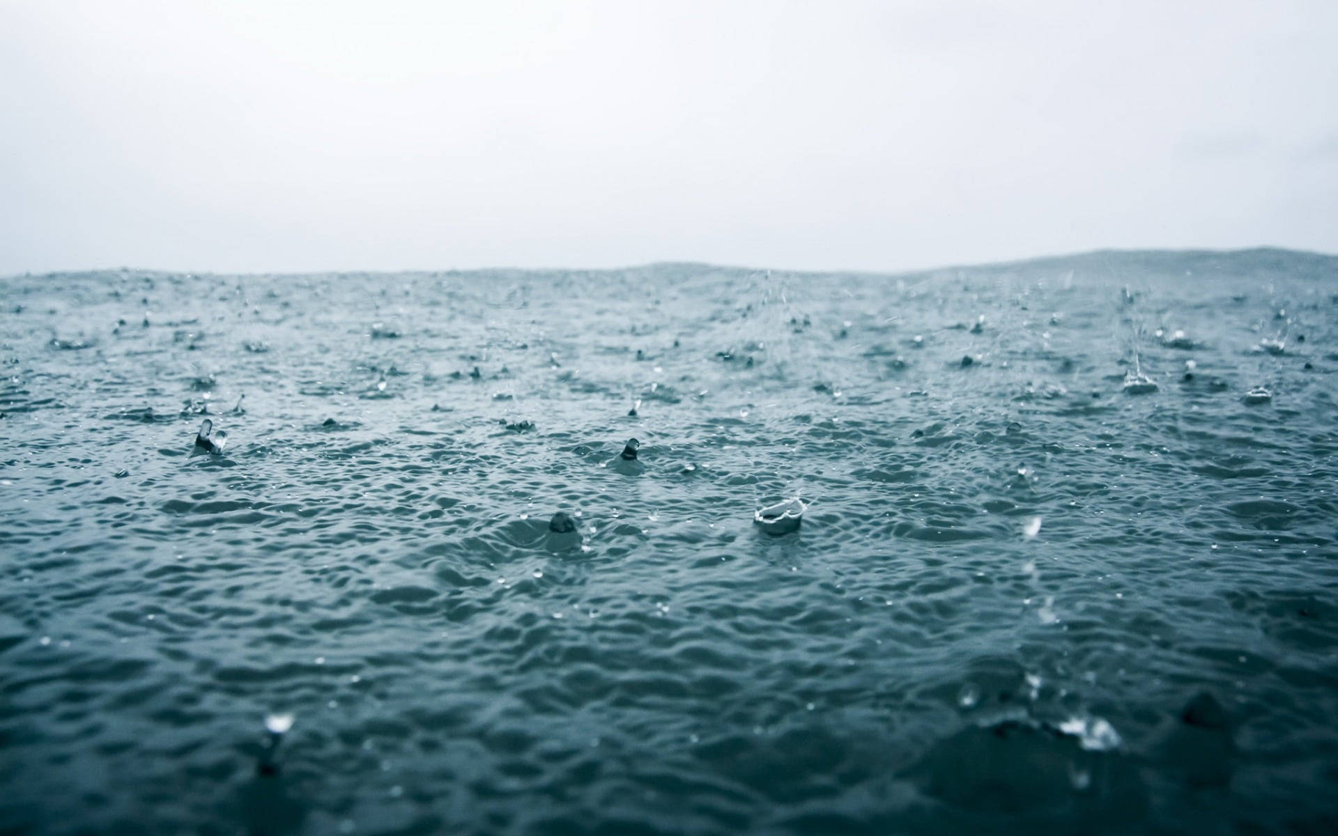 Beautiful Rain Pouring On Water Background