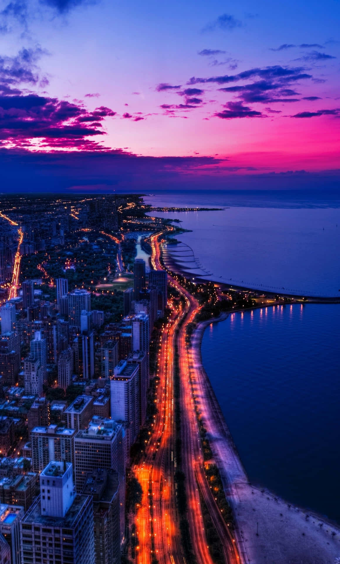 Beautiful Skyline View Of A Bustling City During Sunset Background