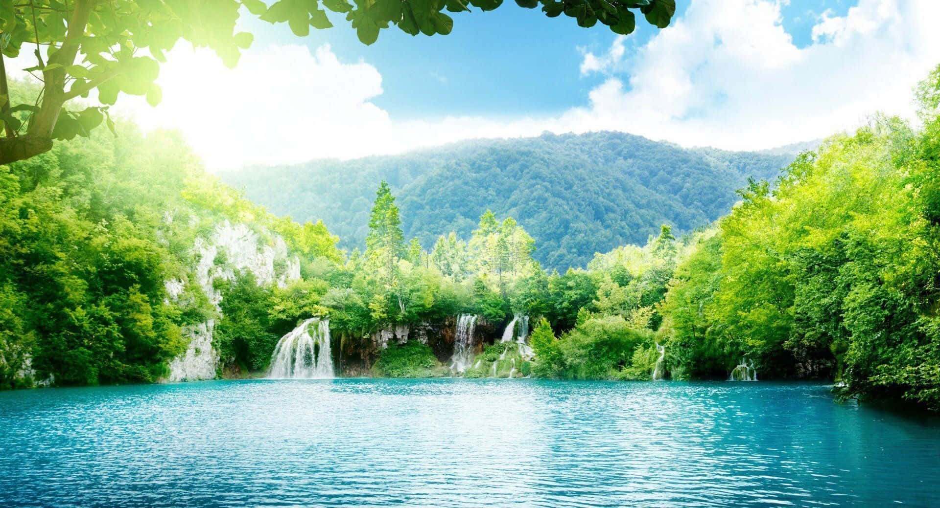 Beautiful Sunny Lake And Waterfalls Background