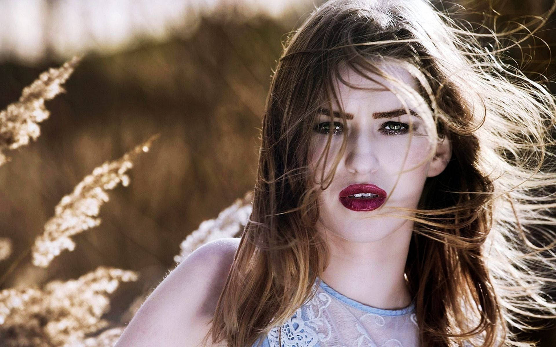 Beautiful Woman With Dark Makeup In A Wheat Field