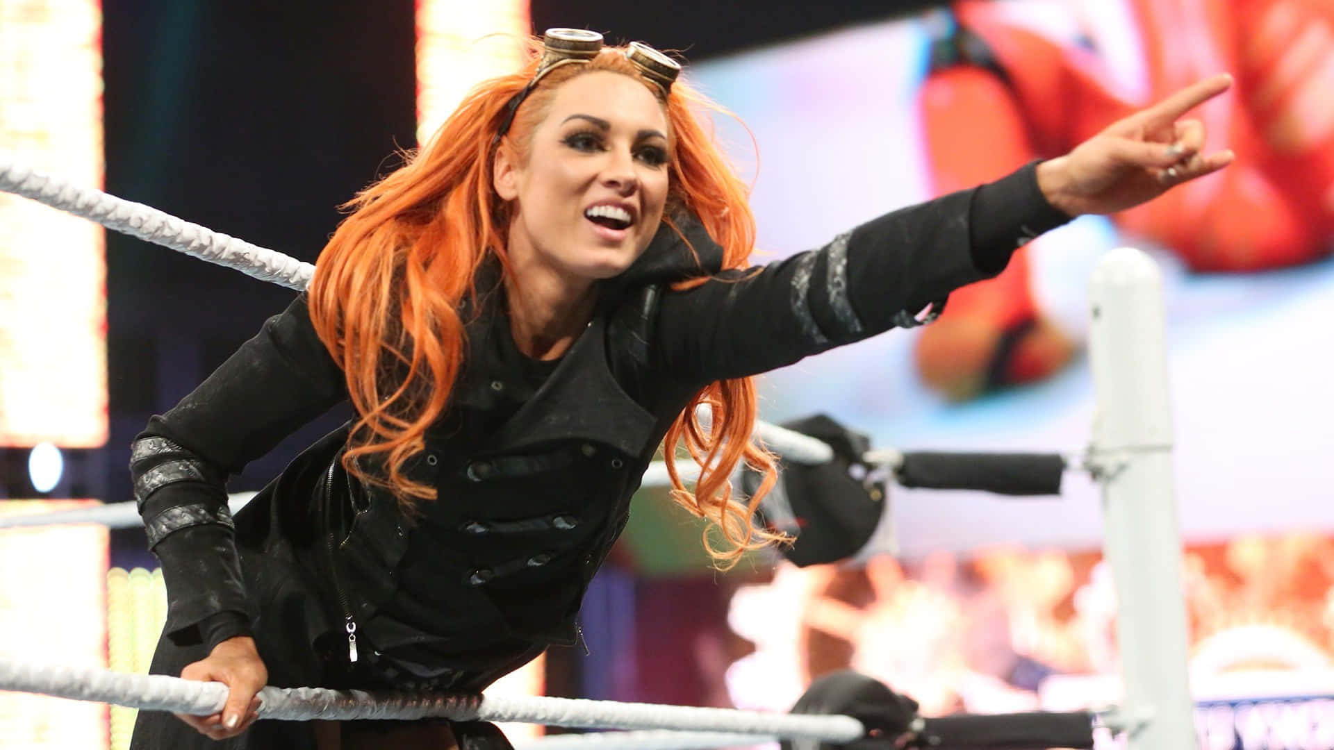 Becky Lynch Rock Hand Sign Background